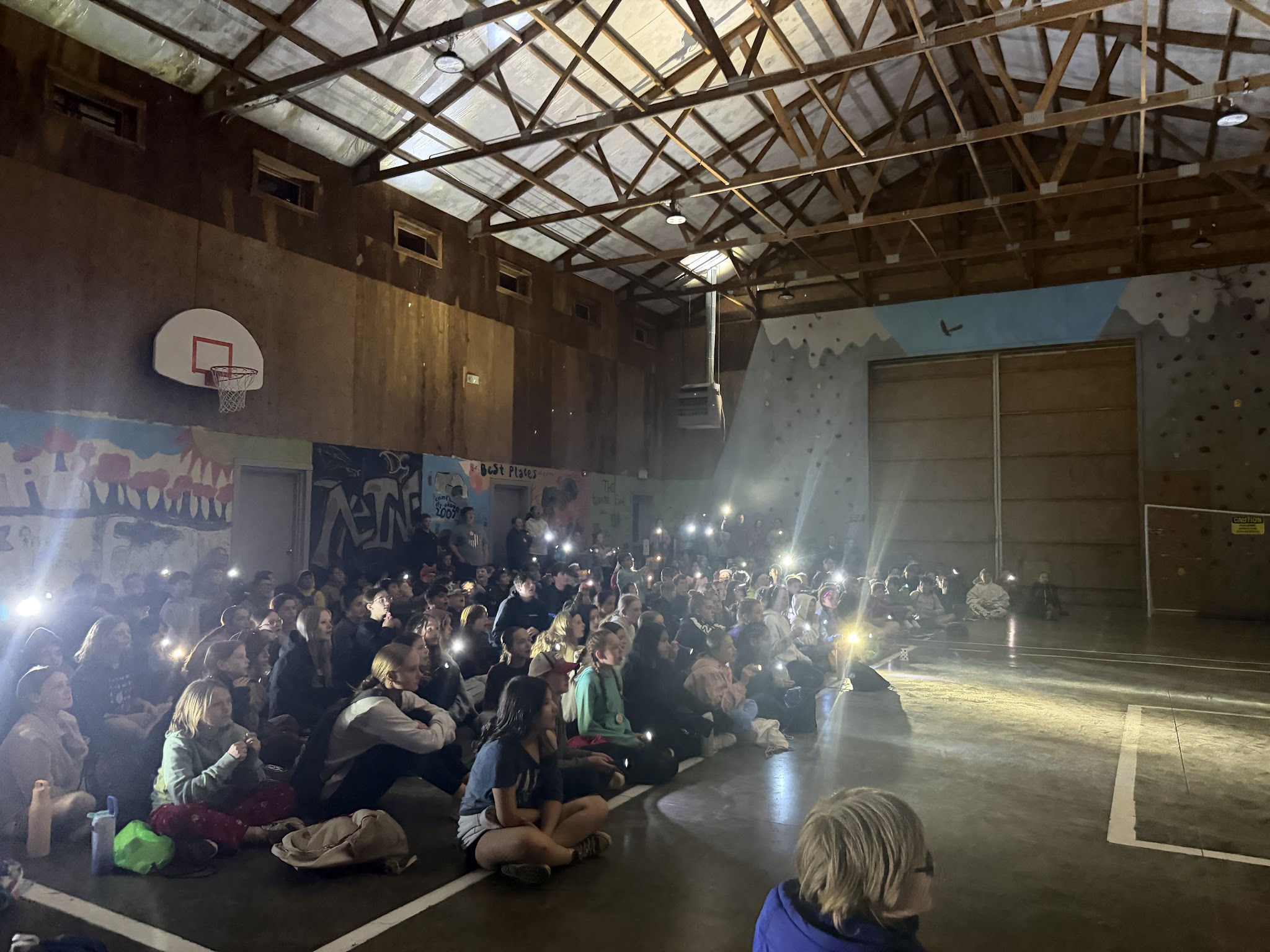 campers in illuminated barn