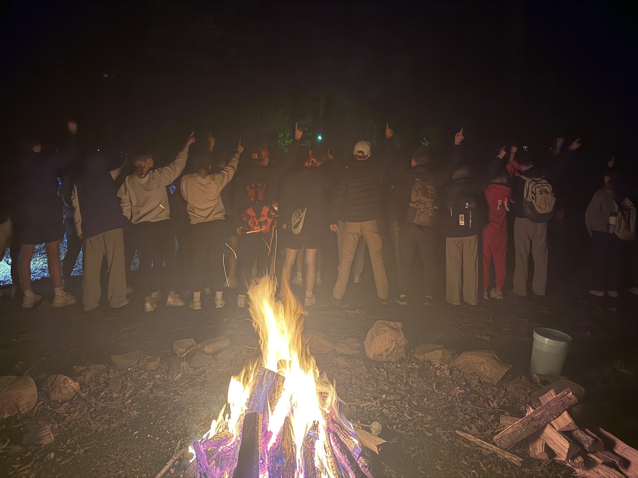 campers at camp fire