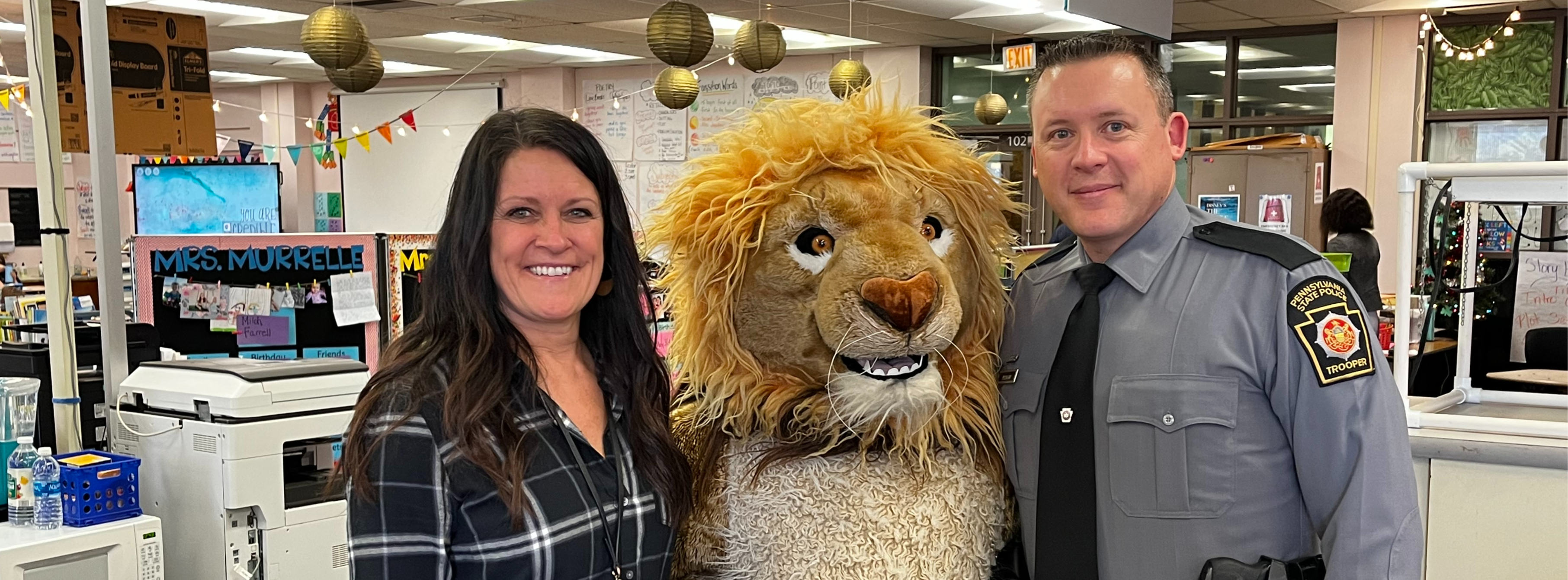 State Trooper with teacher and mascot