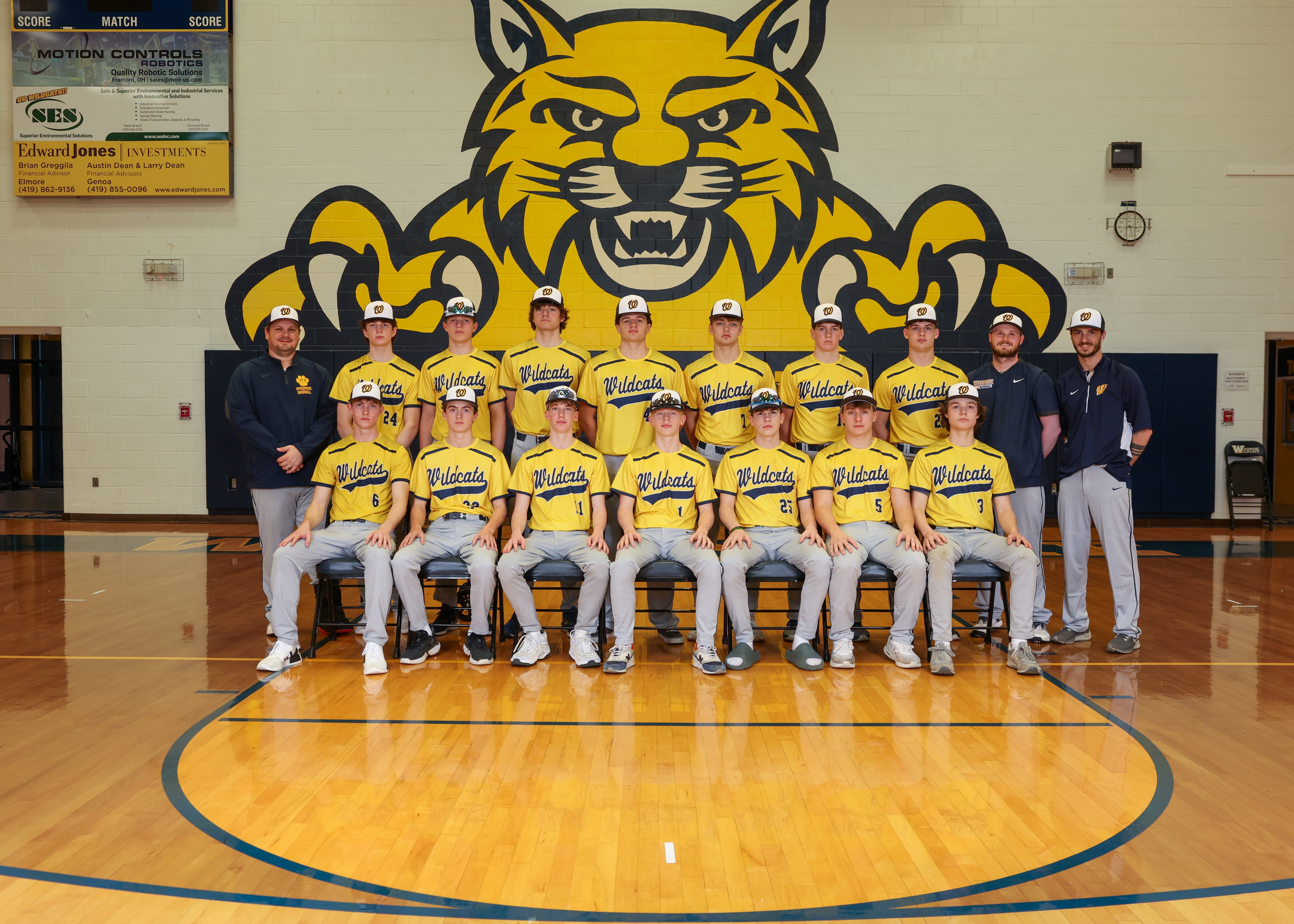 high school baseball team photo in basketball gym