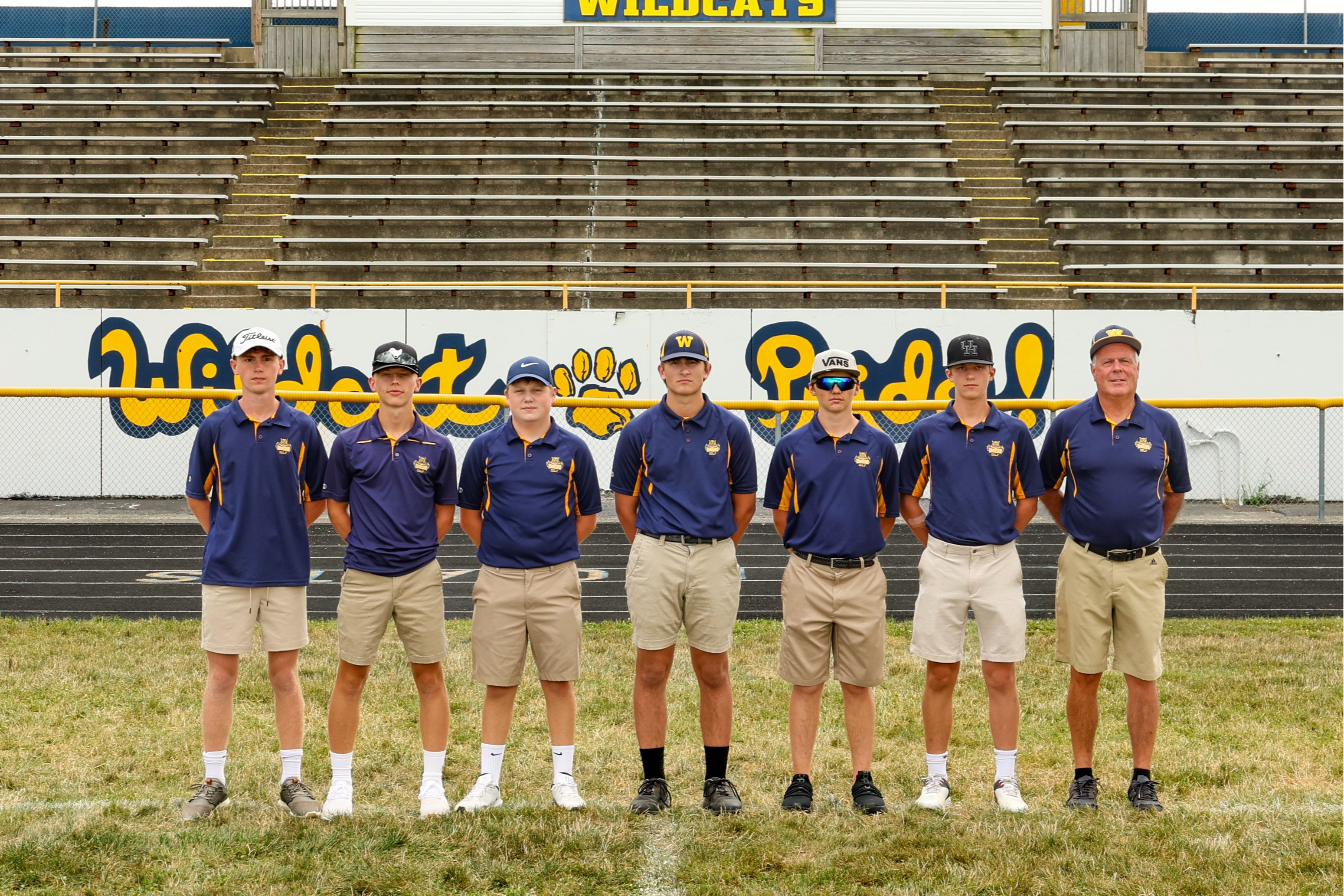 Boys Golf Team Sanding on a Course