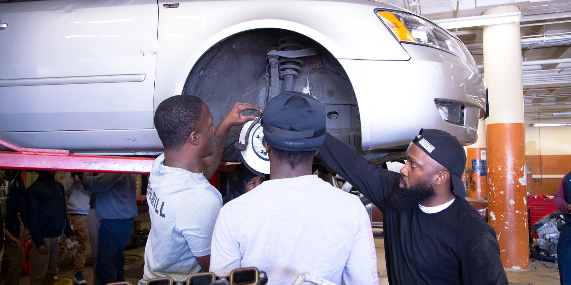 people looking at car