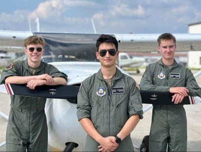 jrotc members posing with plane