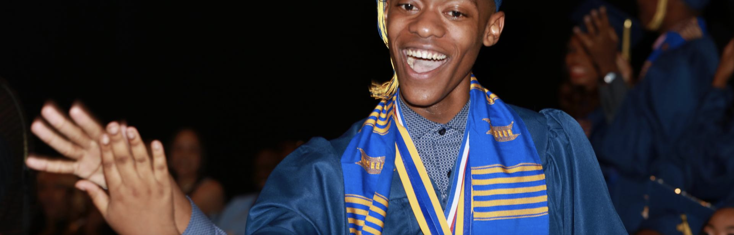 boy smiling at his graduation