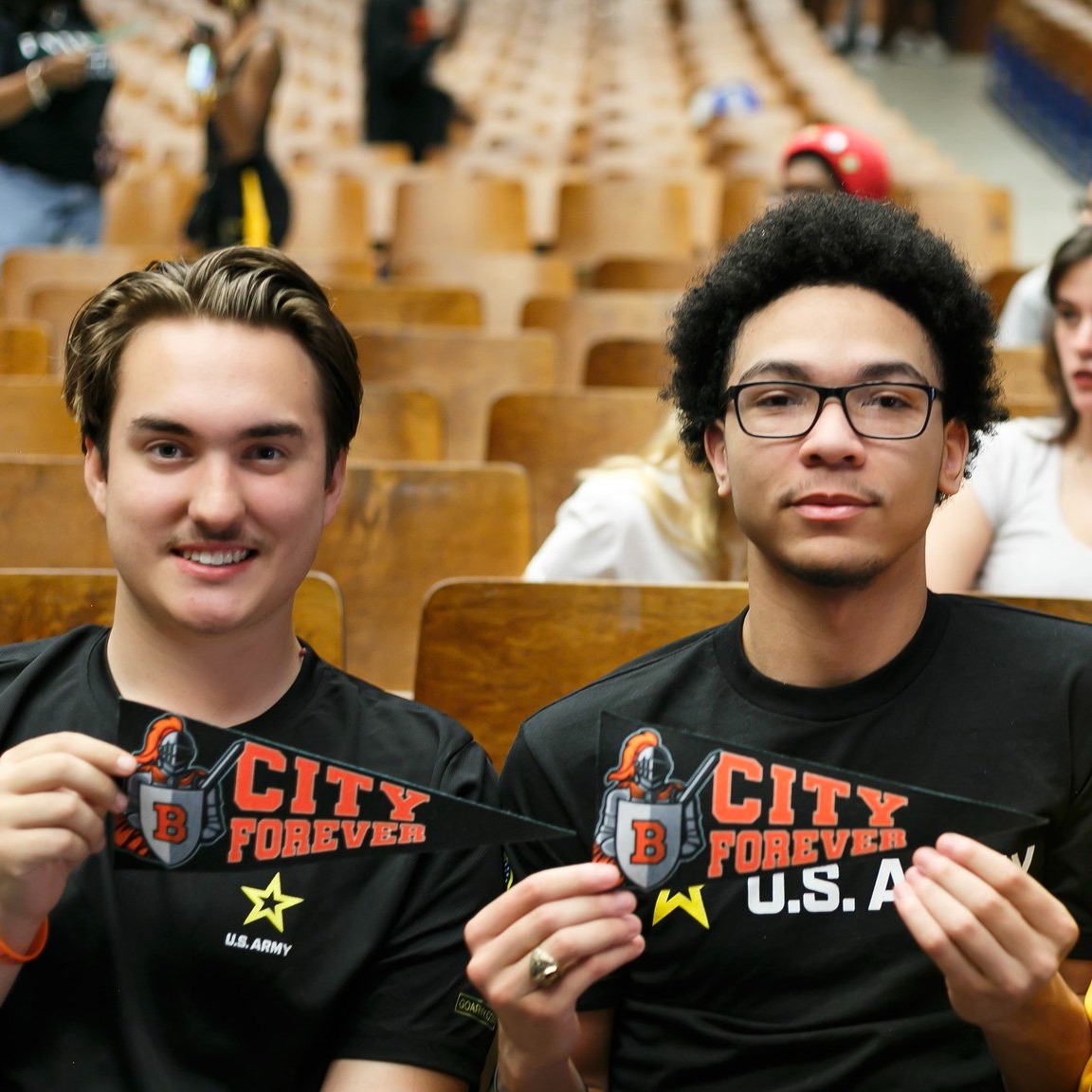 City College students pose with banners at college decision day 2024