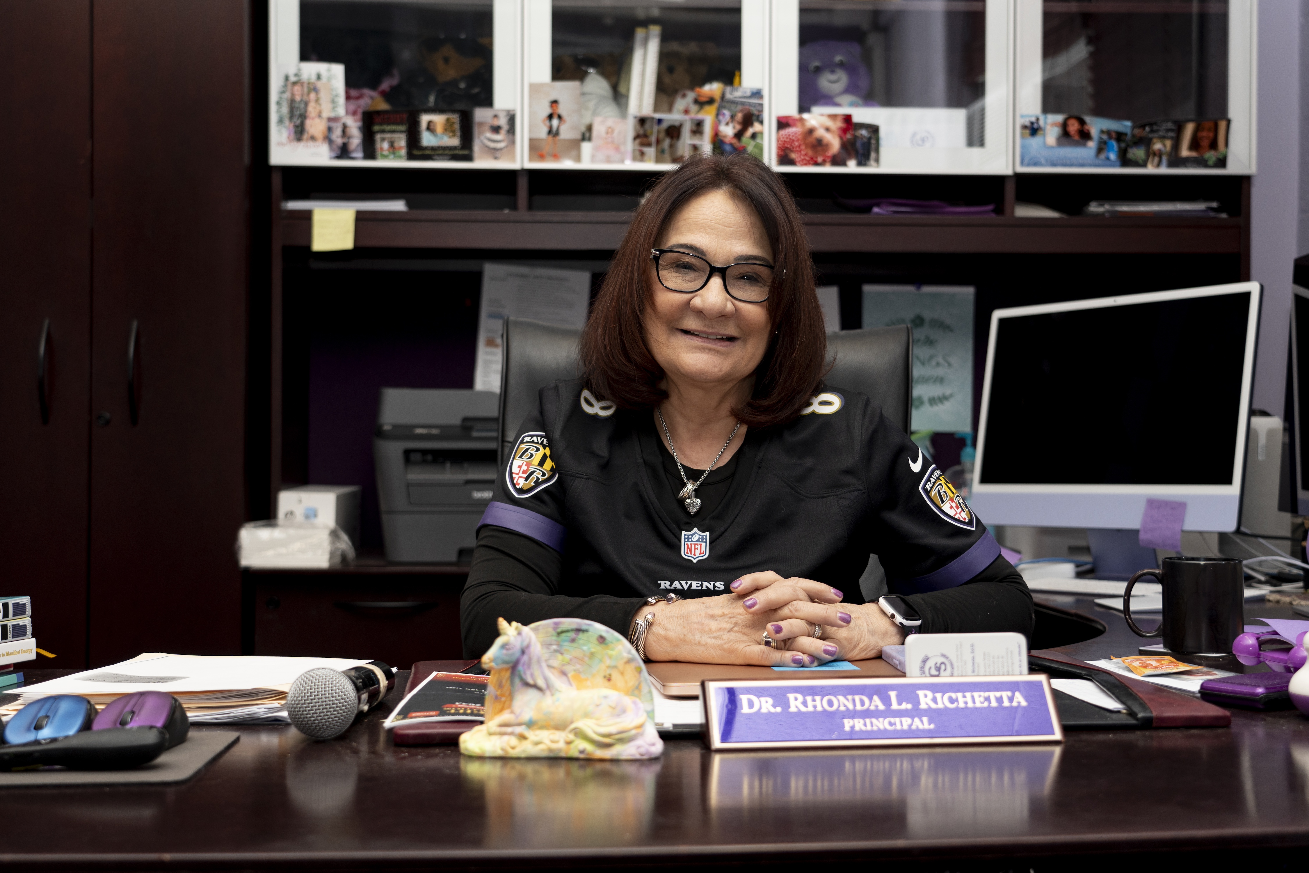 City Springs Principal sits at her desk