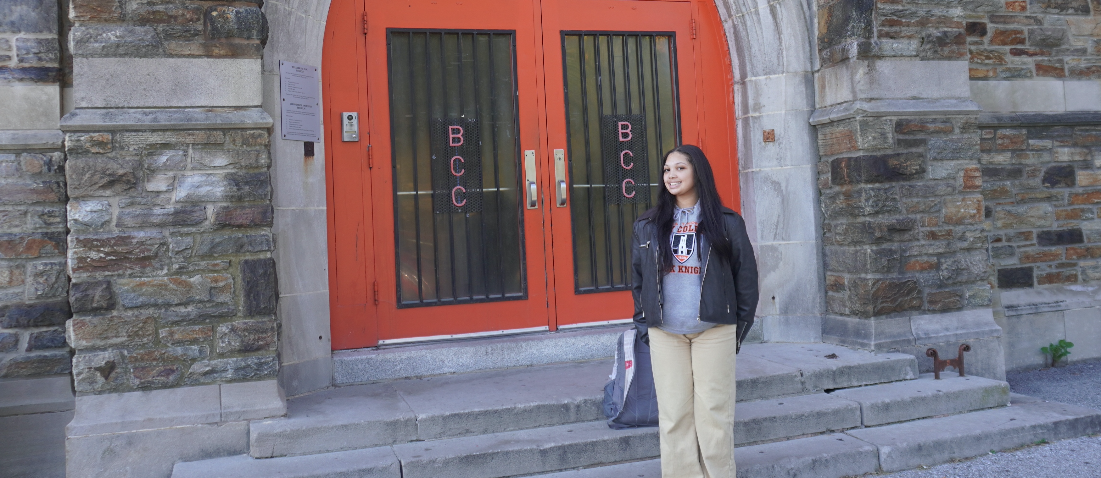 Zoe Ayers, a senior at Baltimore City College, poses by the schools front door