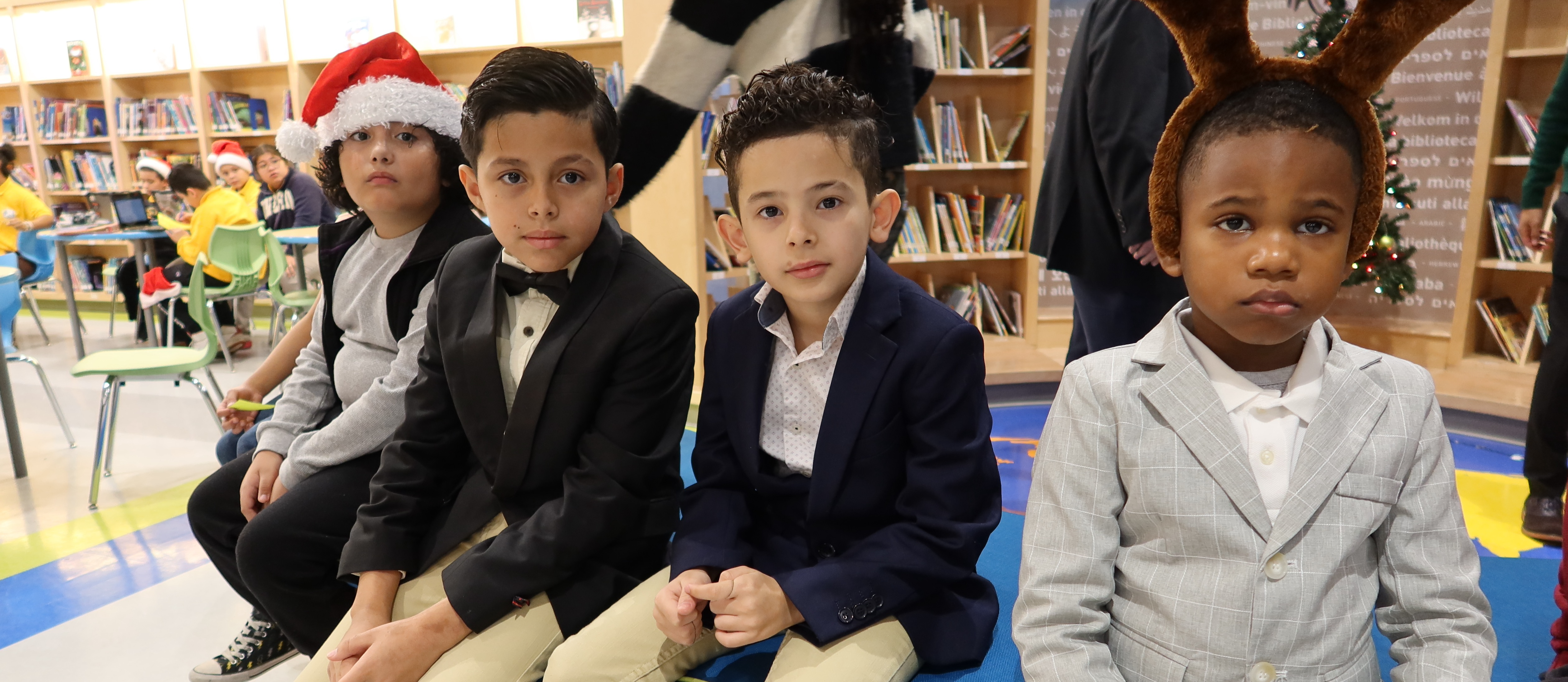 Fallstaff Elementary students pose for a picture in their holiday-themed formal wear.