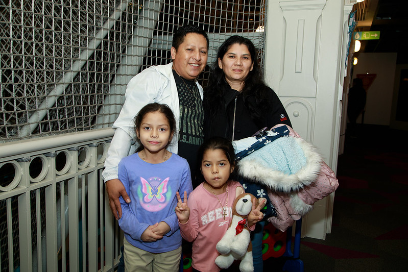 Family poses for a picture at districtwide math night at Port Discovery