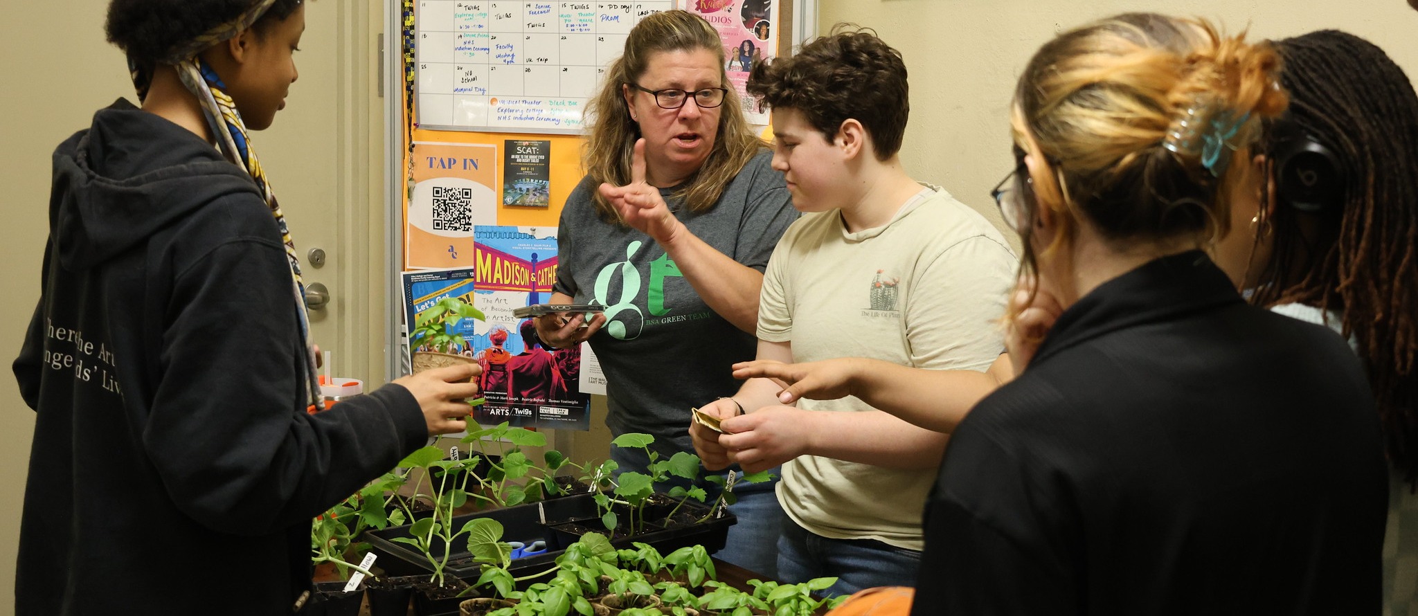 BSA students buy and sell seedlings on neighborhood cleanup day.