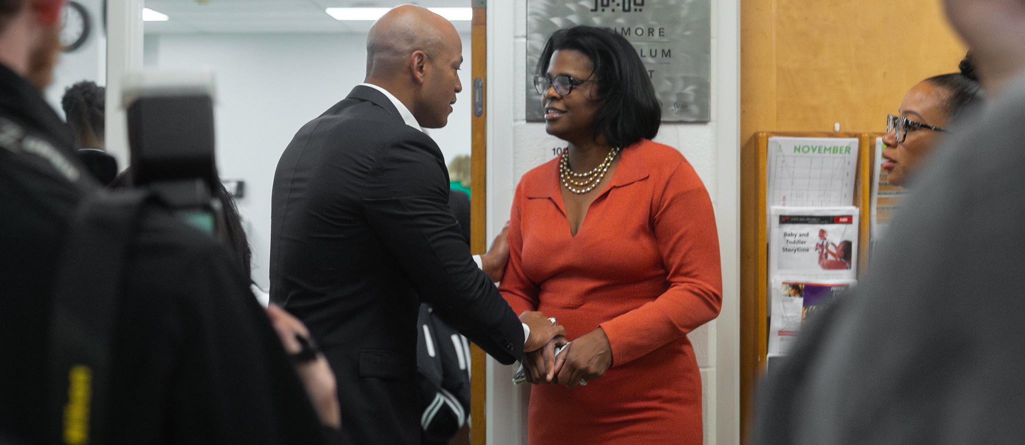 CEO Santelises shakes hands with governor Wes Moore