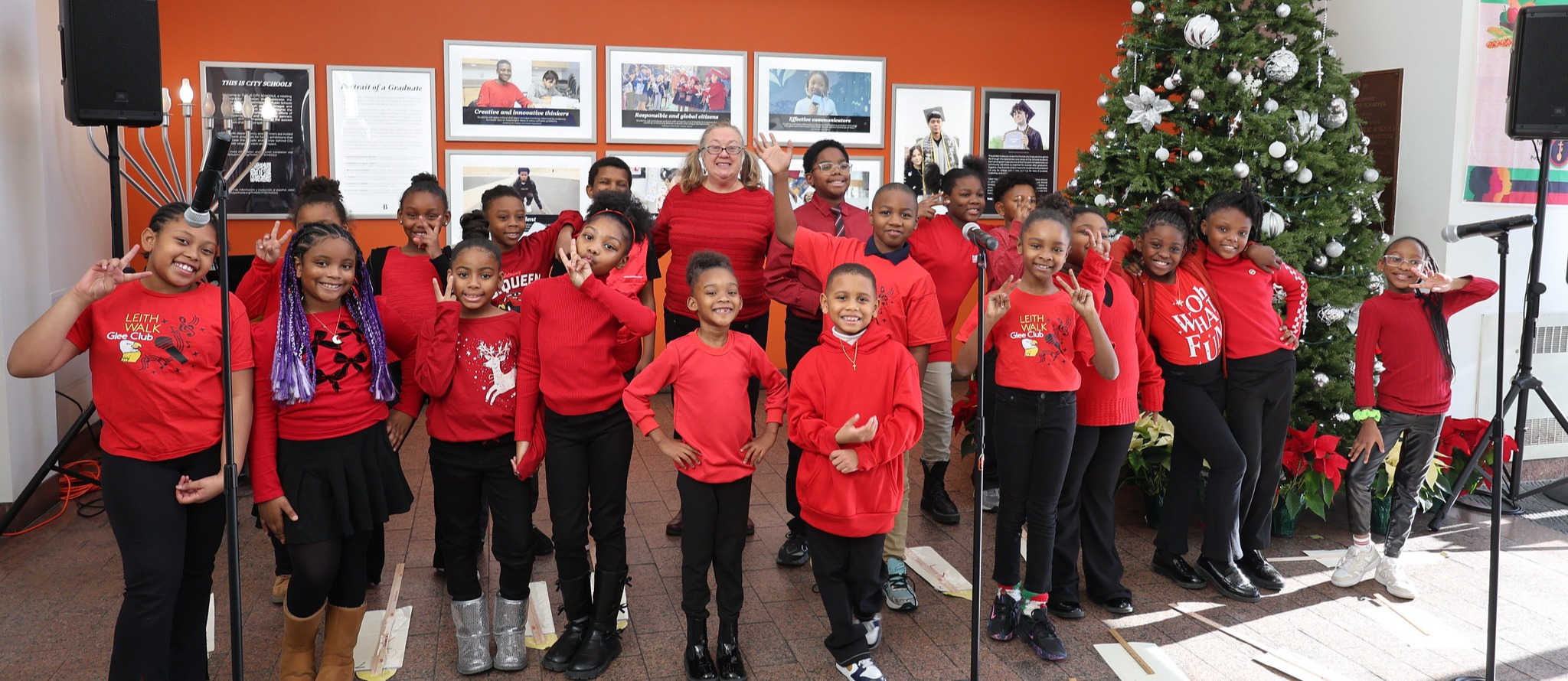 Students pose for a holiday pictures in the Office of Communications and Enrollment