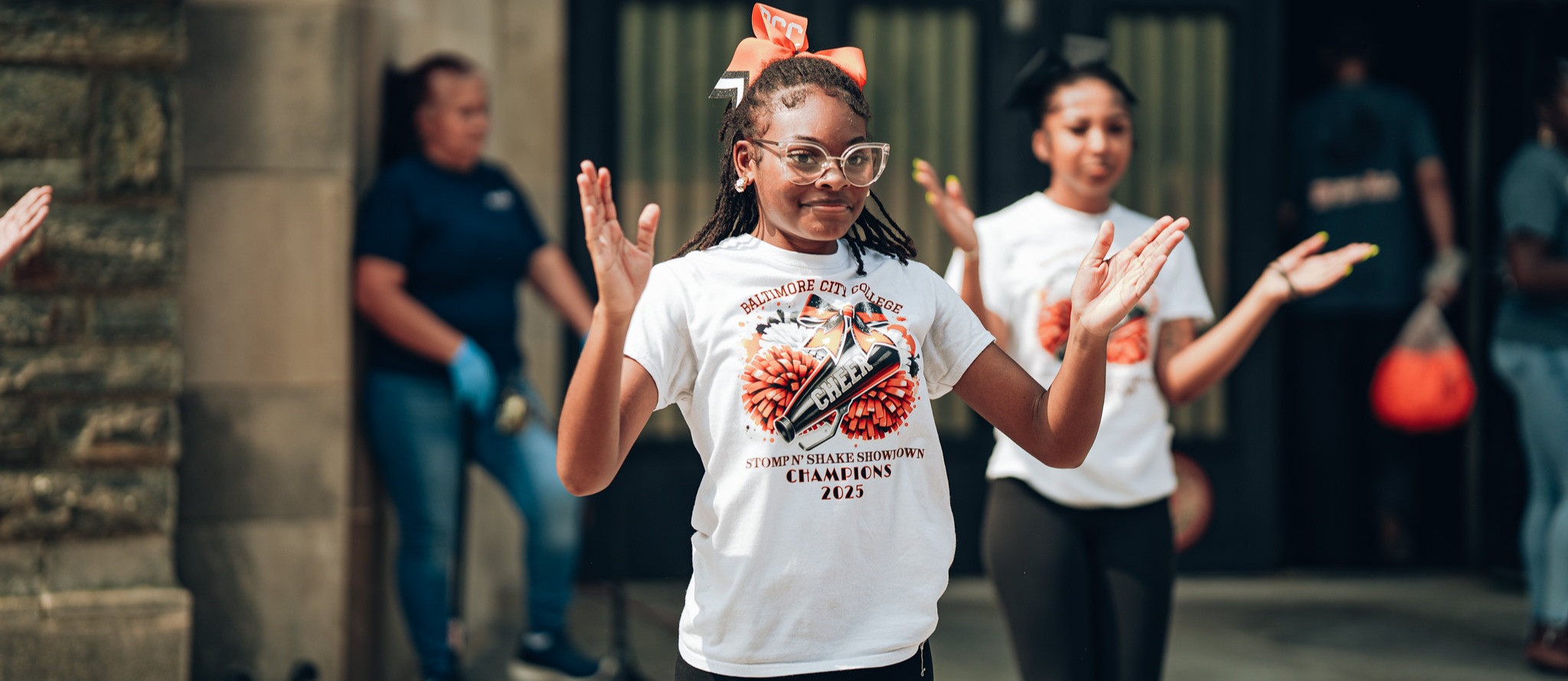 City College students performing outside during freshmen welcome event