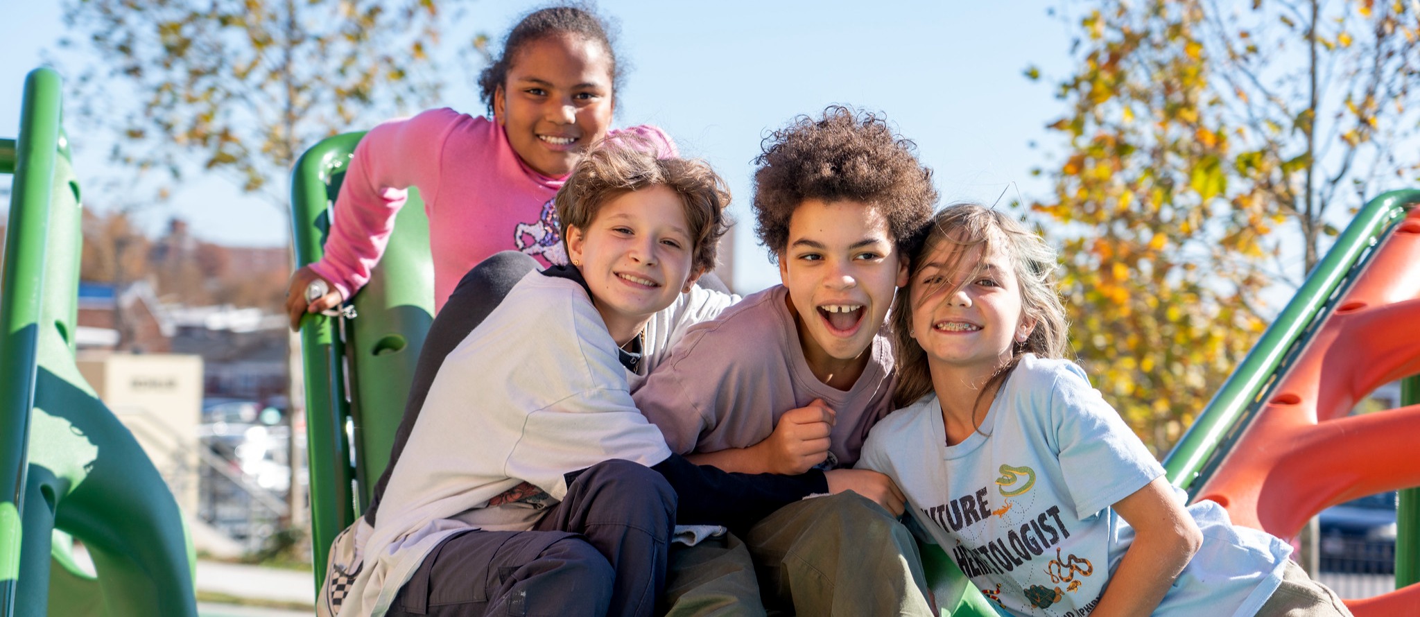 Four students playing on the playground