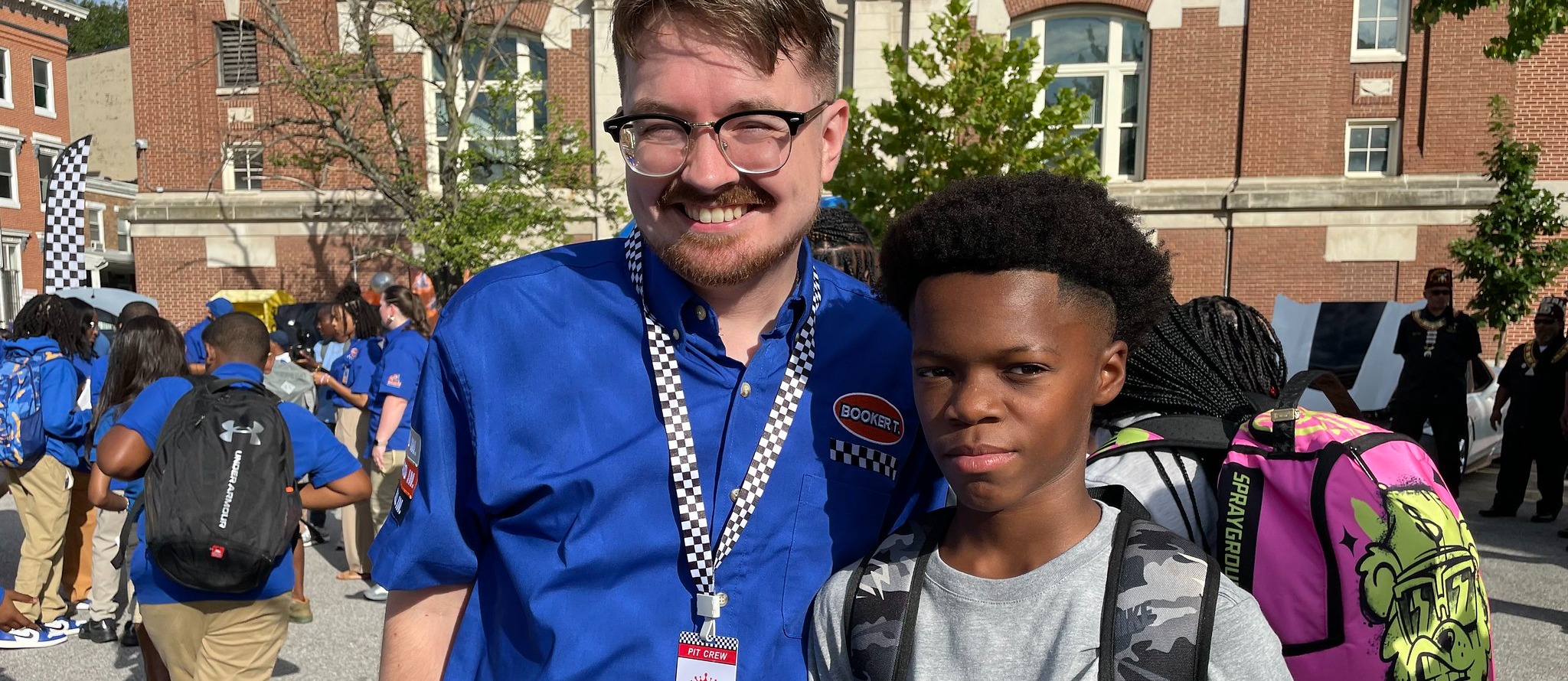Teacher posing with student