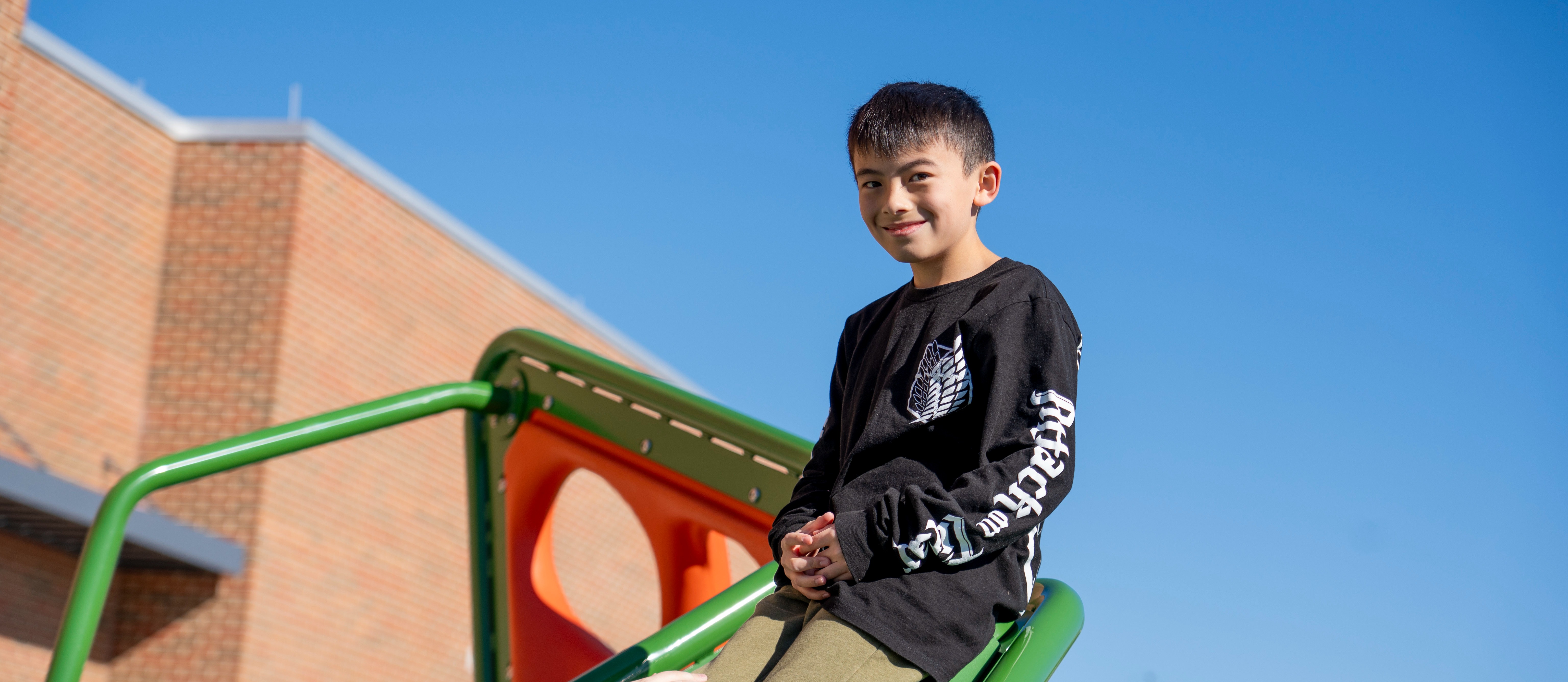 Student playing on playground