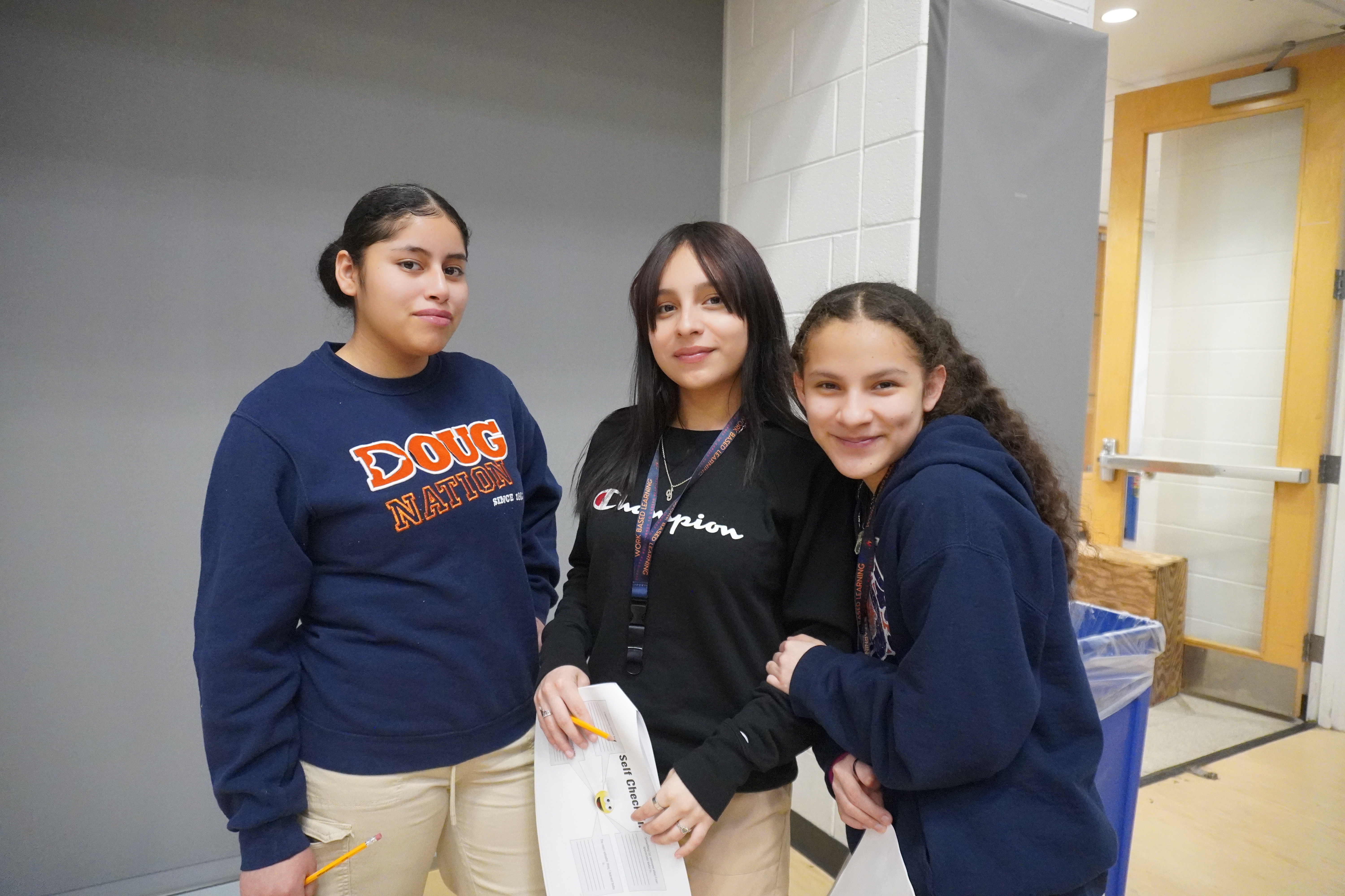 Three students posing for the camera
