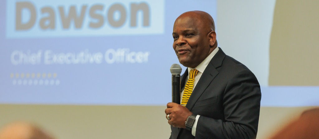 CEO Dr. Dawson with mic in his hand