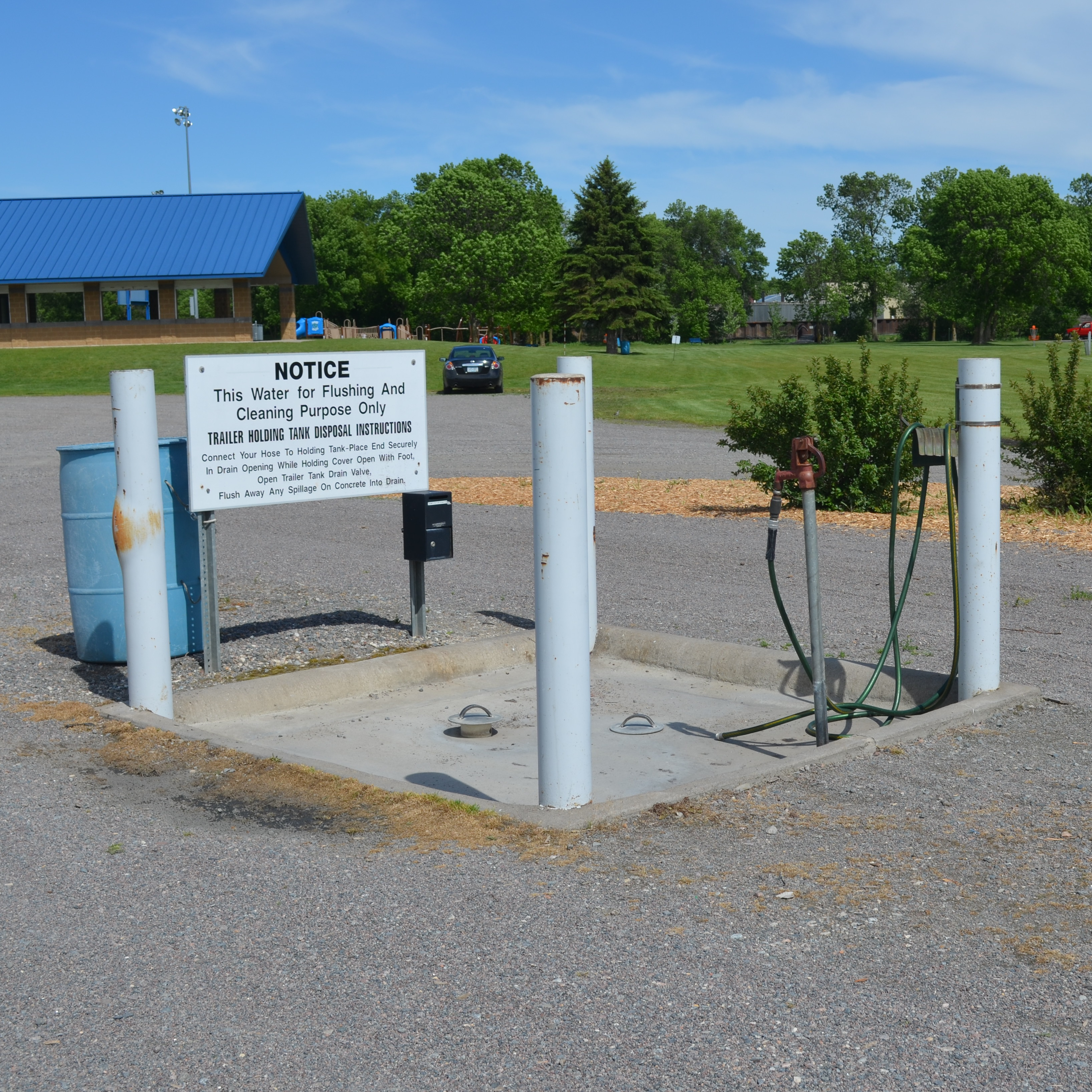 notice. this water for flushing and cleaning purpose only trailer holding tank disposal instructions. connect your hose to holding tank-place end securely in drain opening while holding cover open with foot, open trailer tank drain valve, flush away any spillage on concrete into drain.