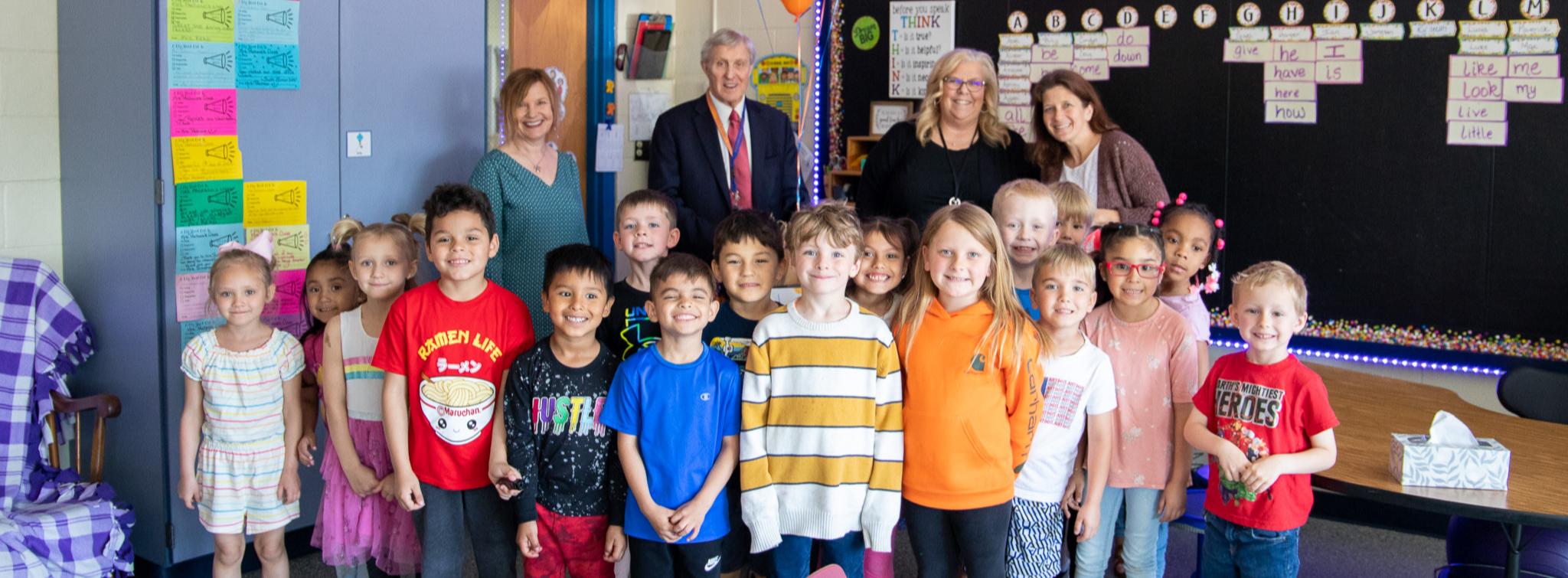 image of students and staff smiling at camera