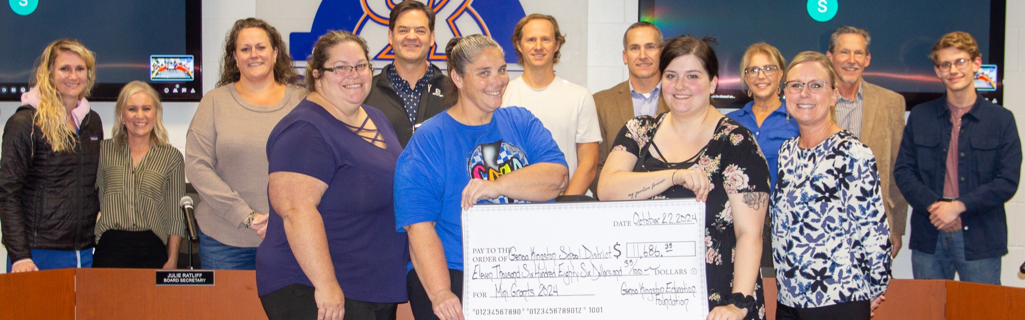 GKEF awarding check at board meeting