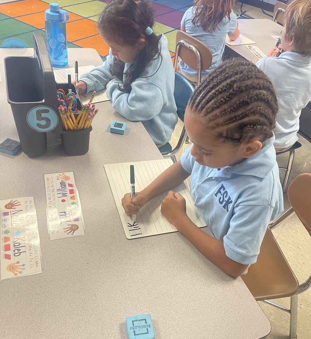 students writing at desk