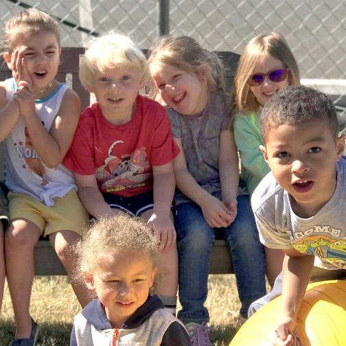 Group pic of kids together; current button/logo for Head Start program