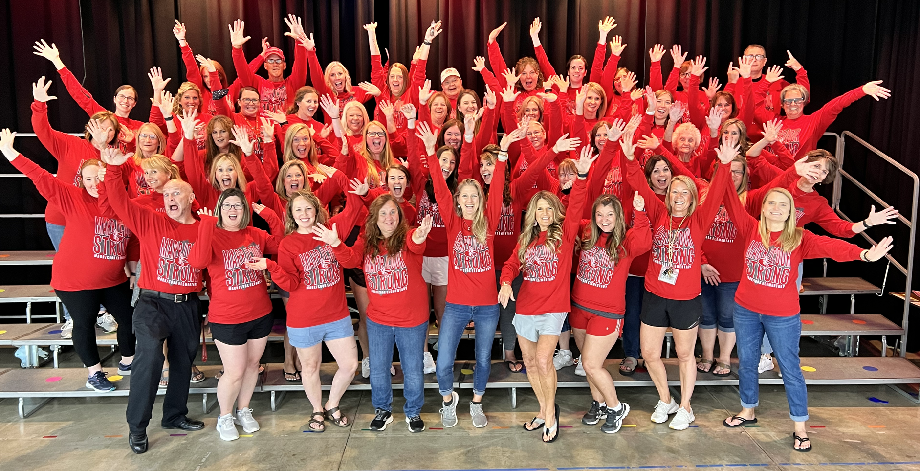 A group of teachers cheering