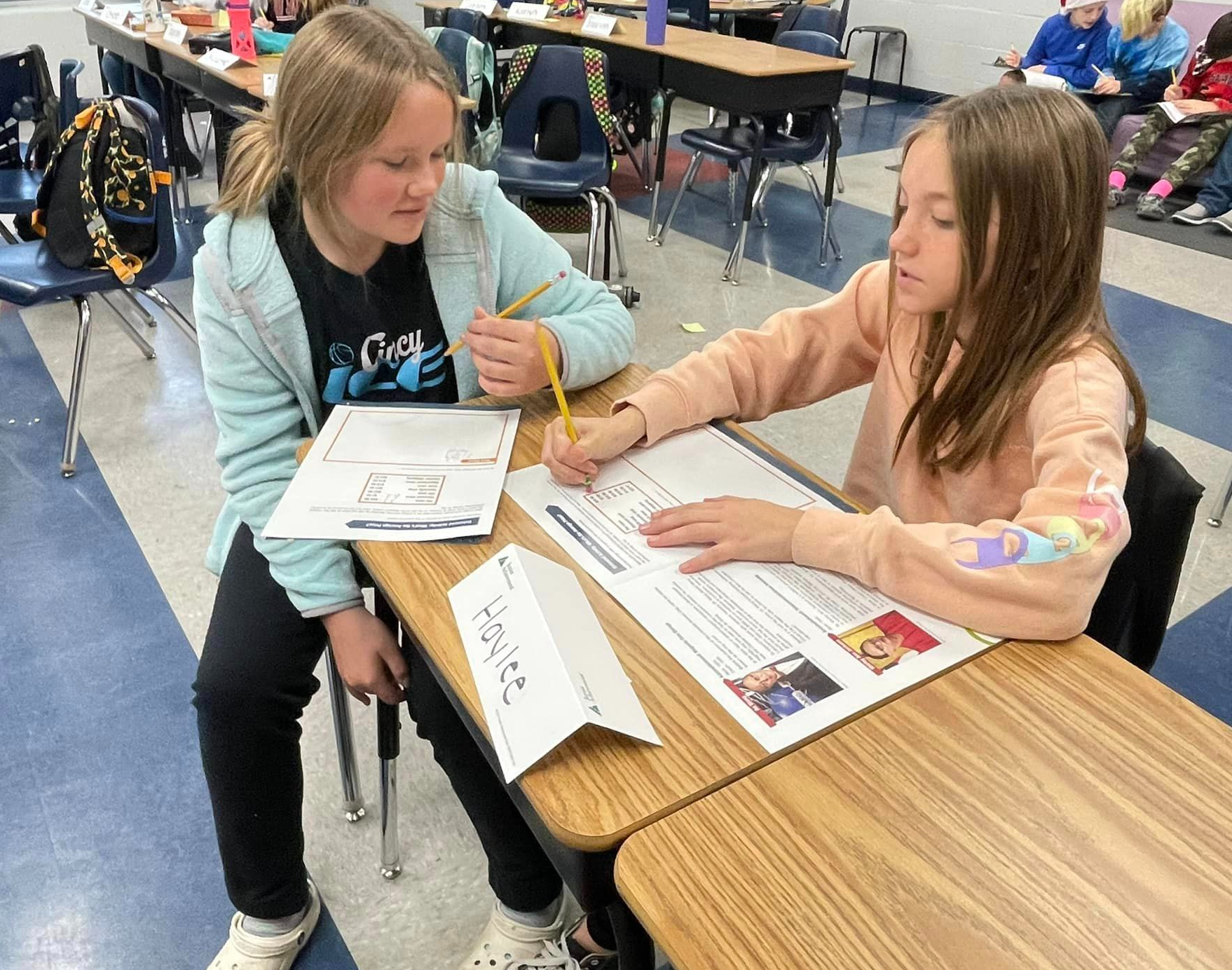 Two students working at a desk