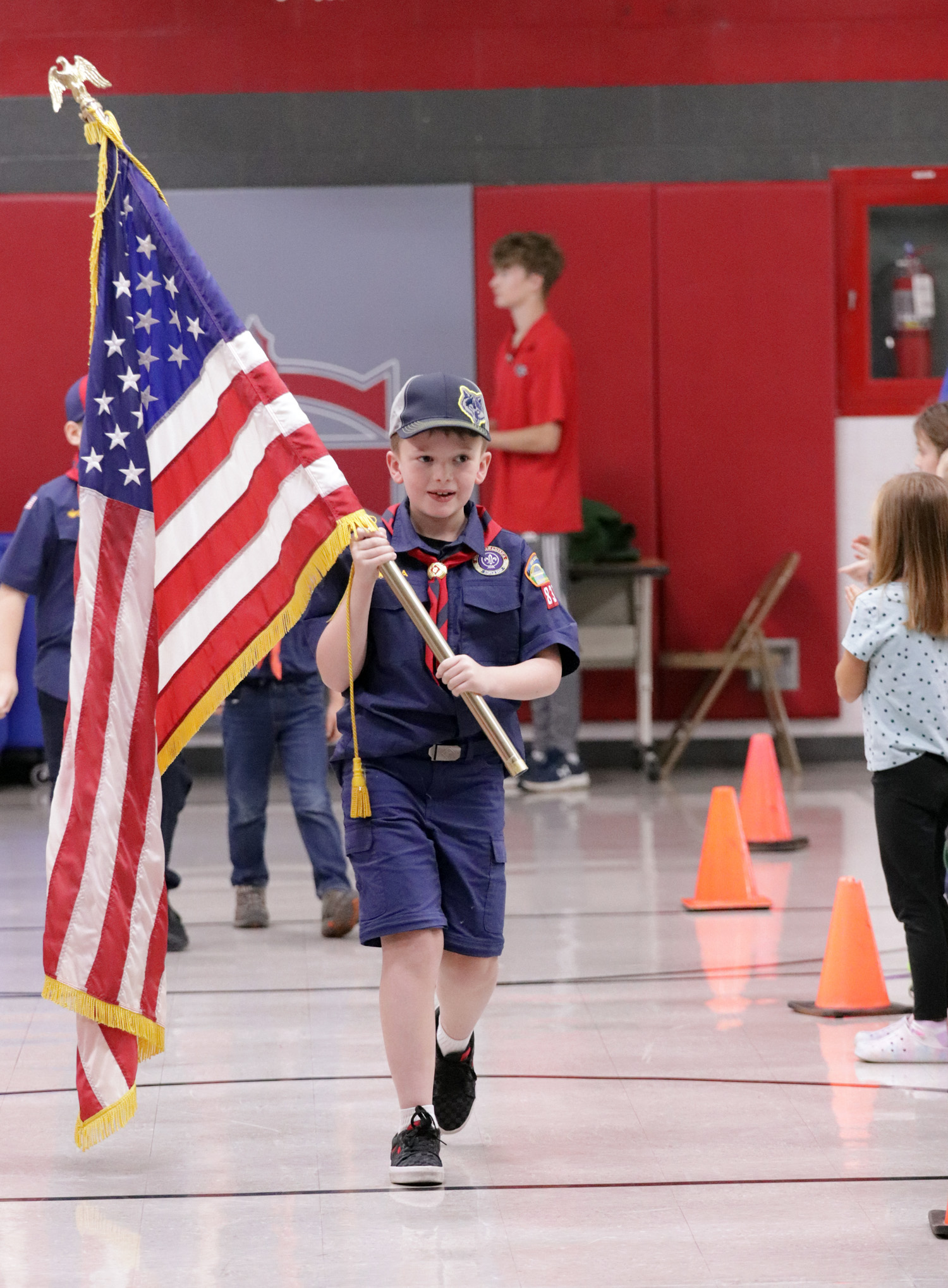 scout carrying flag