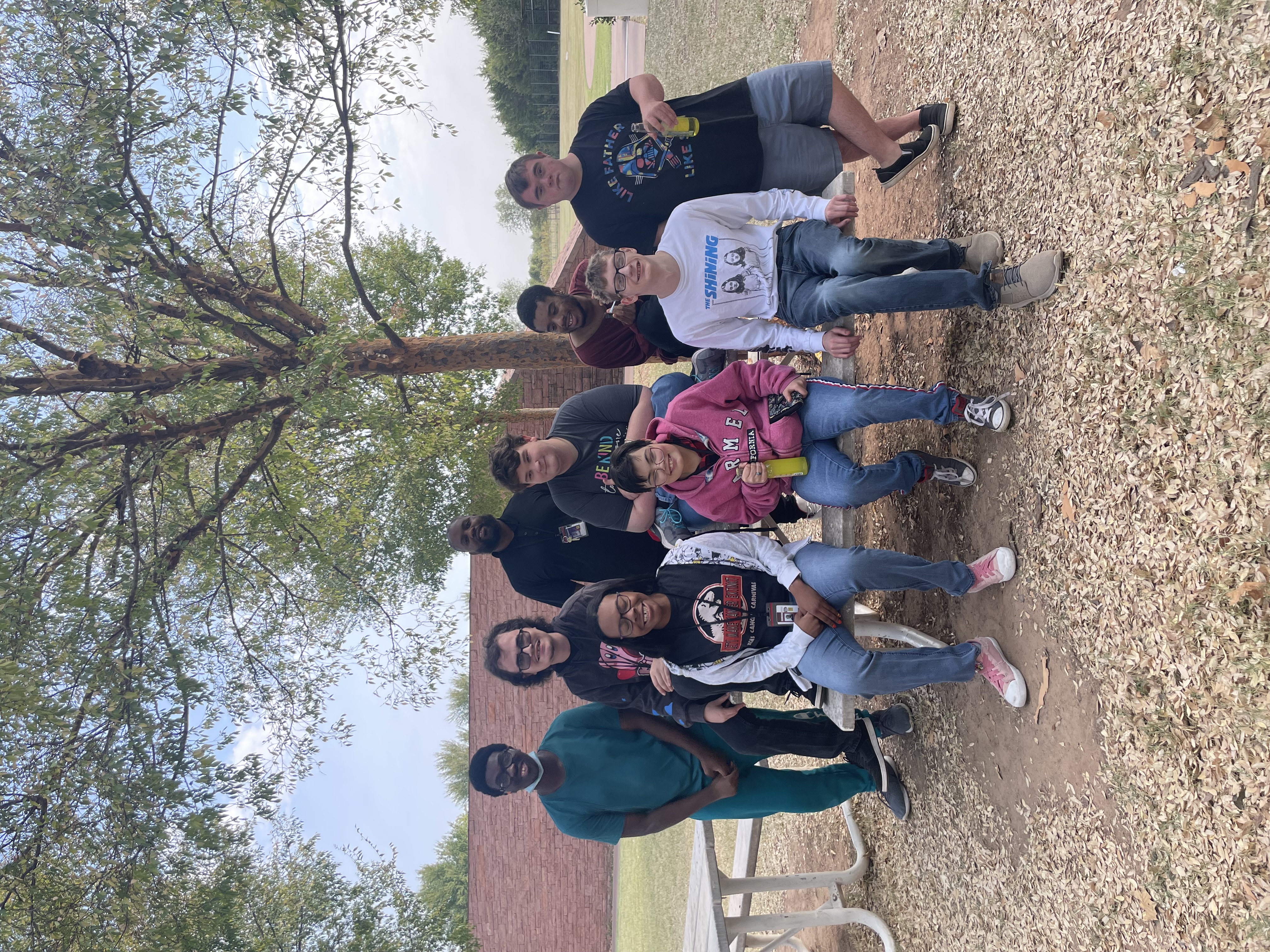 Students sitting at picnic table