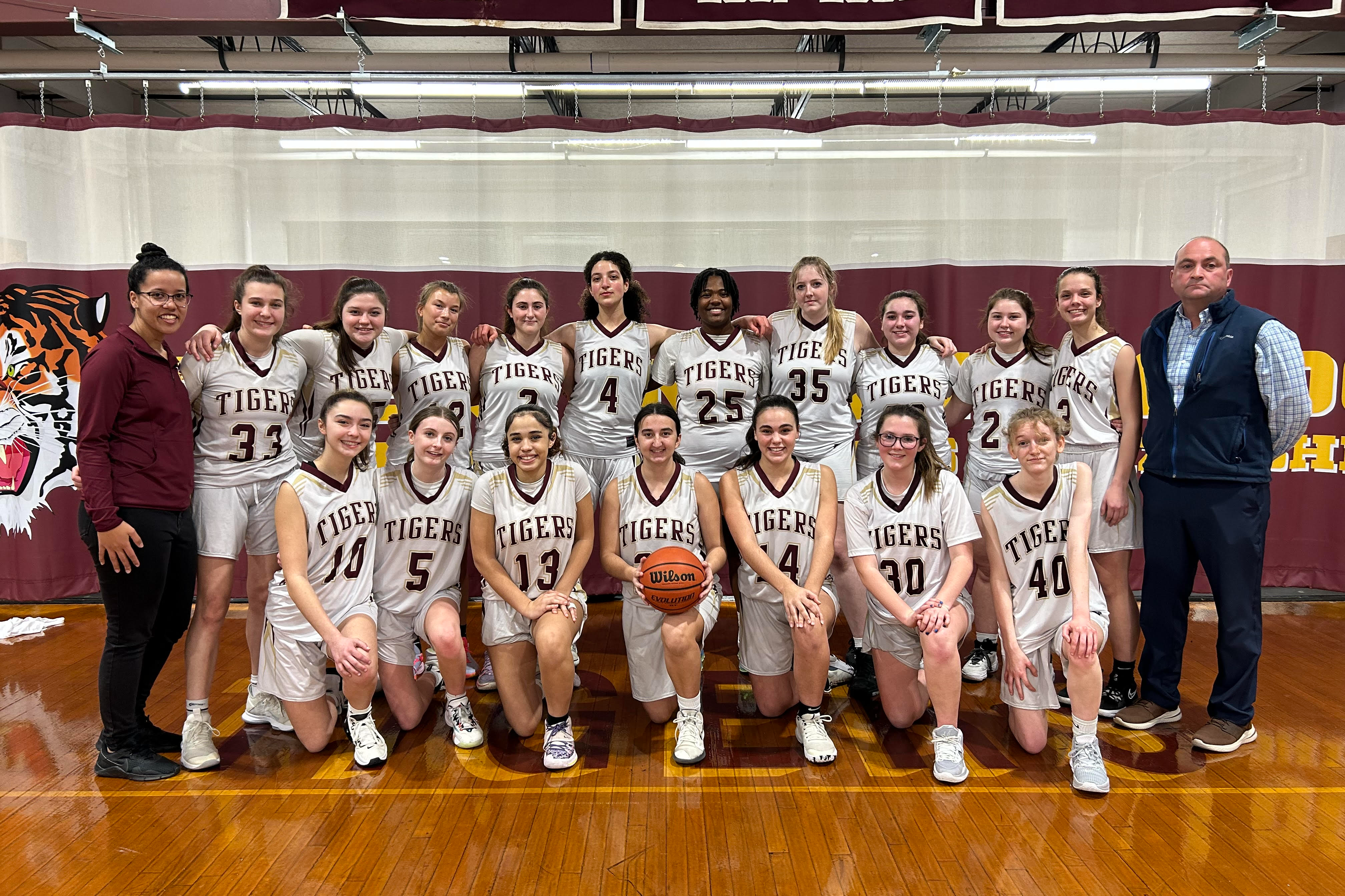 Team photo of girls team and coaches