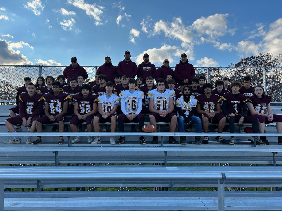 Football team photo in the bleachers