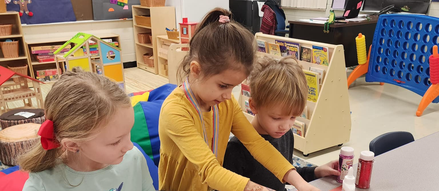 Capac Elementary students completing an art project