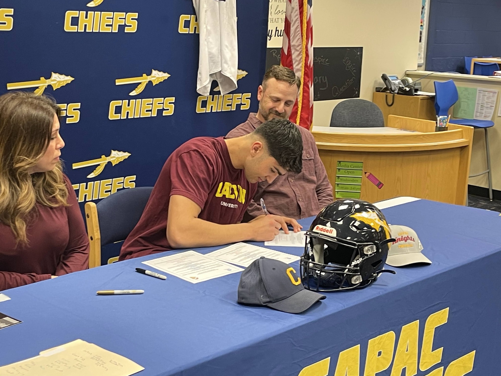 photo of Blake Baden signing for Calvin University   Football