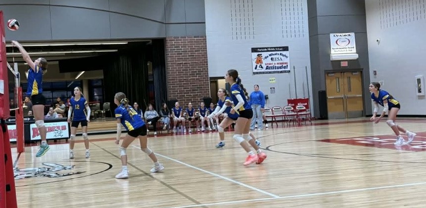 7th grade volleyball team in action against Mendota Northbrook