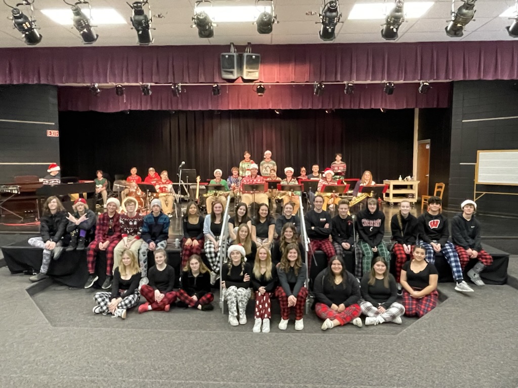 Minor Details and Jazz Ensemble students caroling at Walworth School