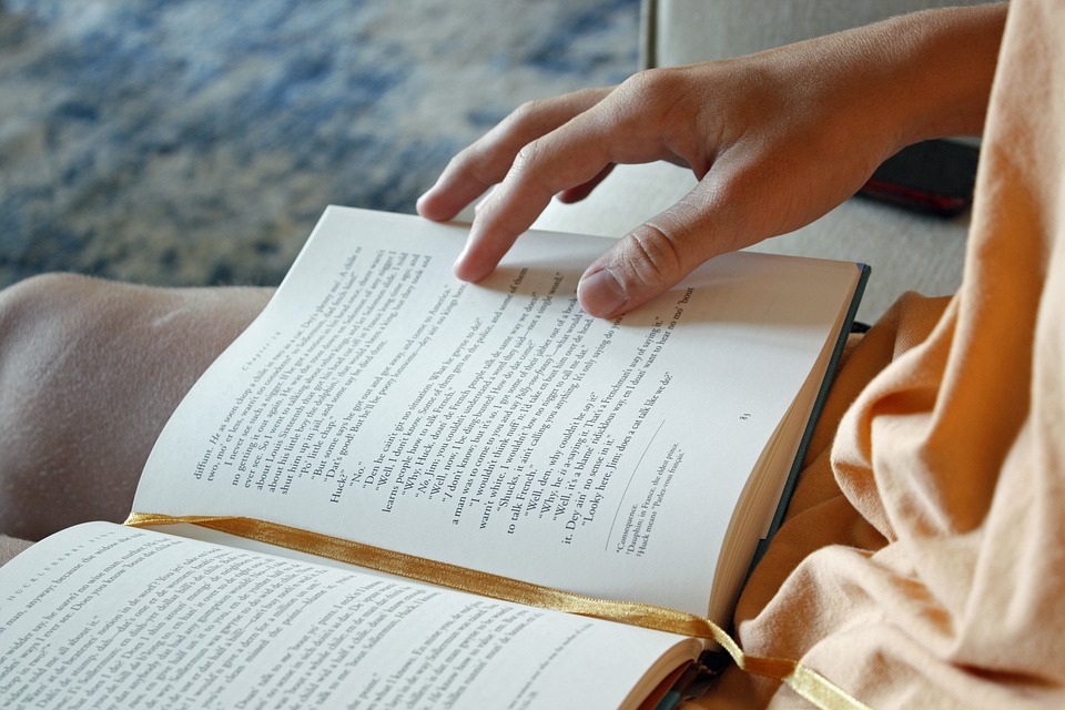 a Hand on a book