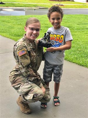 military servicewoman with student