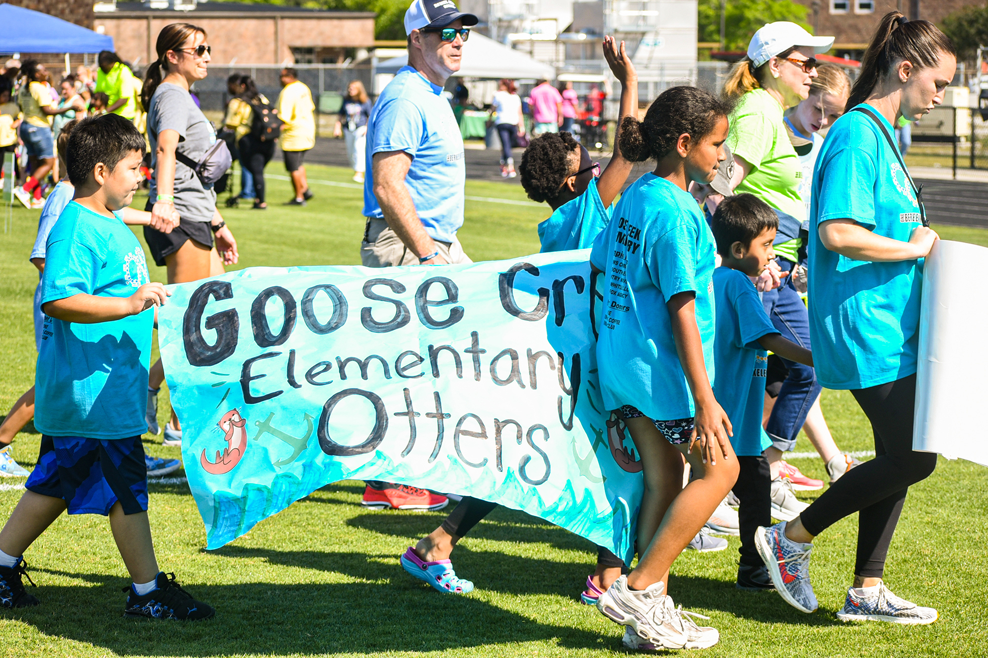 GCE students with banner in parade