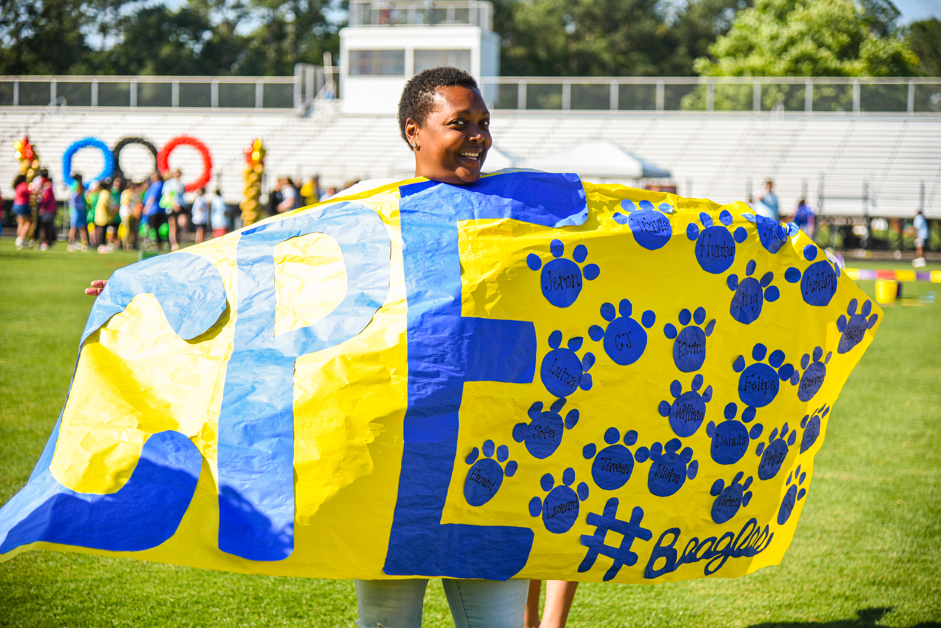 CPE staff member holding up banner