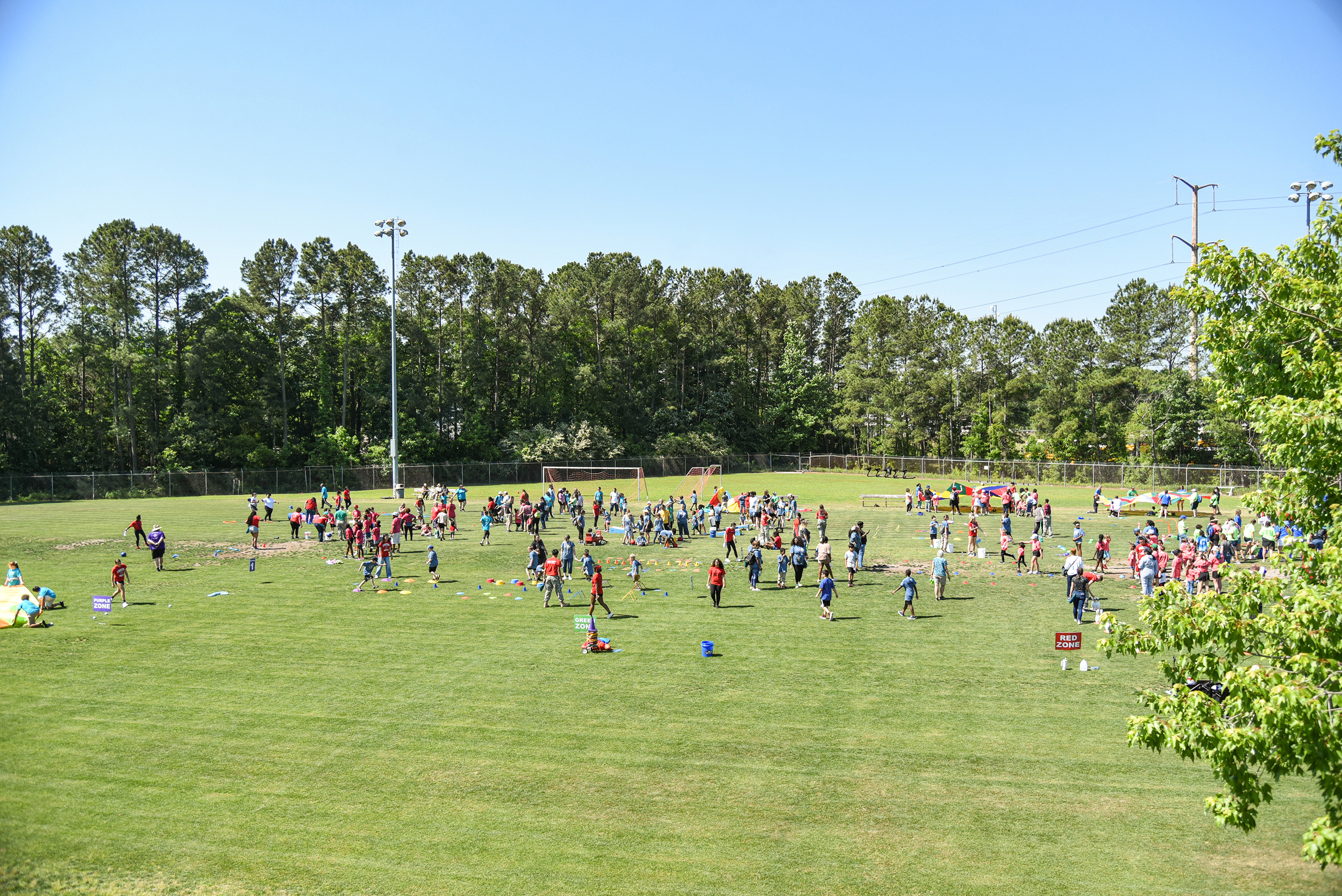 wide view of back field with games going on
