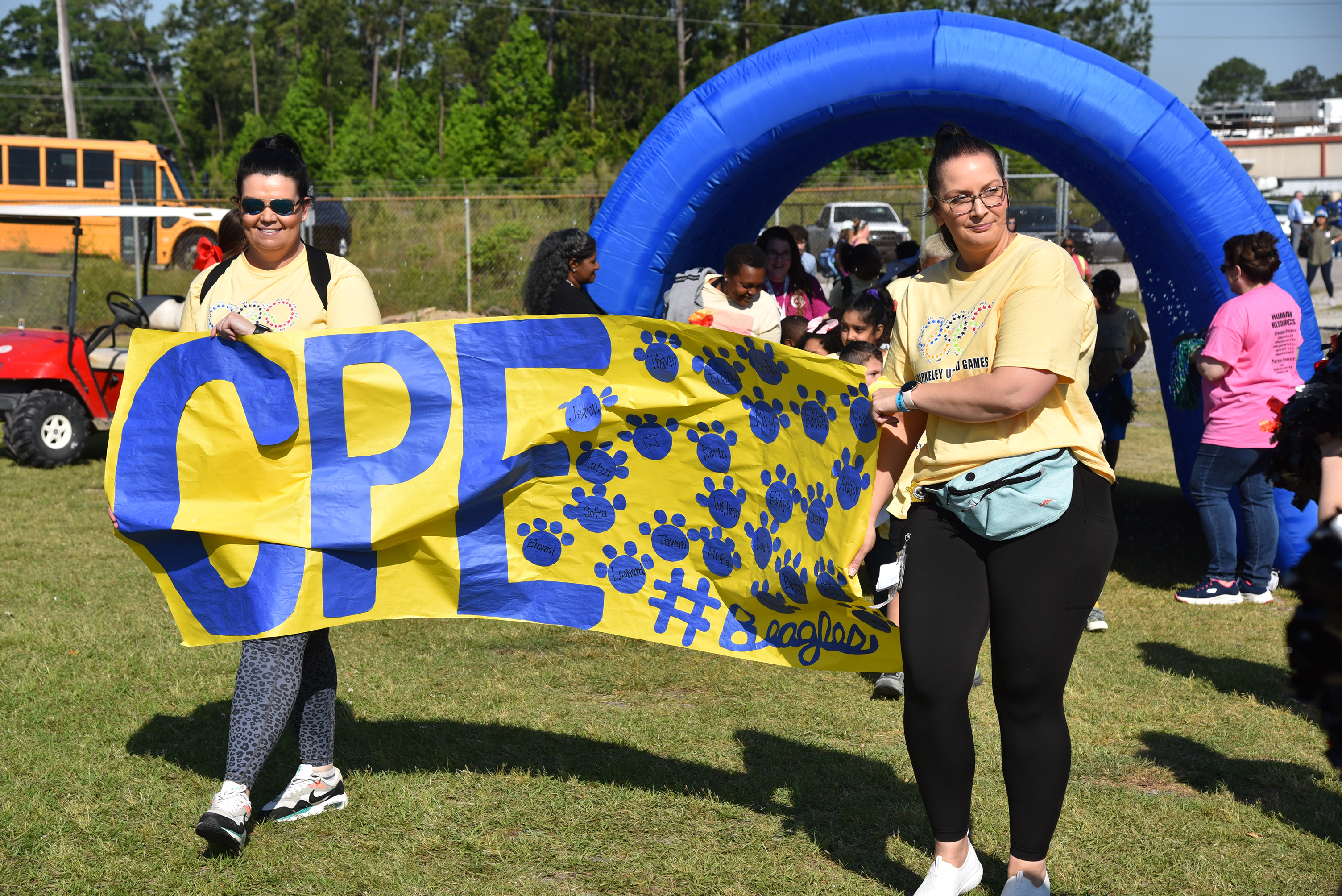 CPE staff with banner