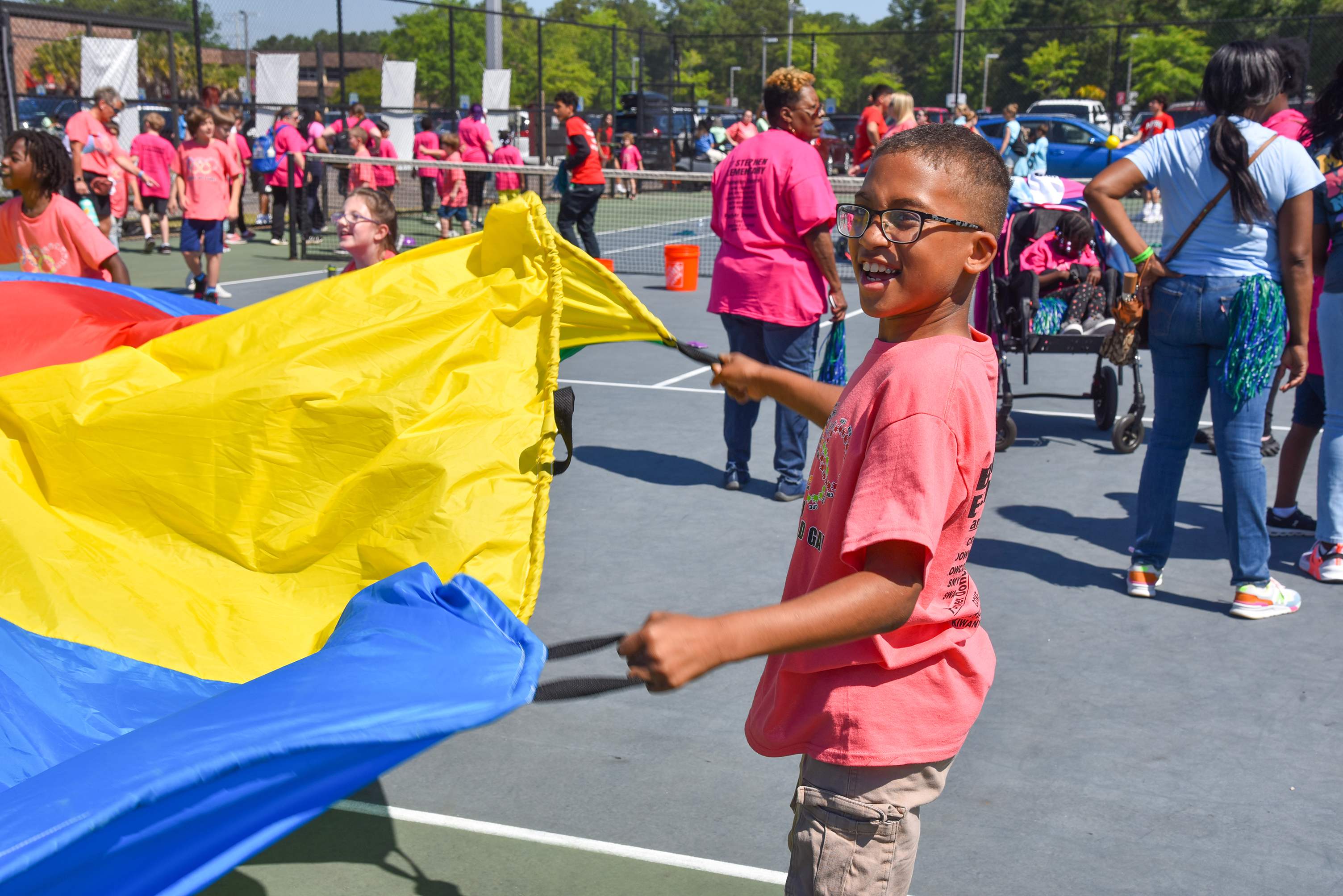 MNE student playing parachutes