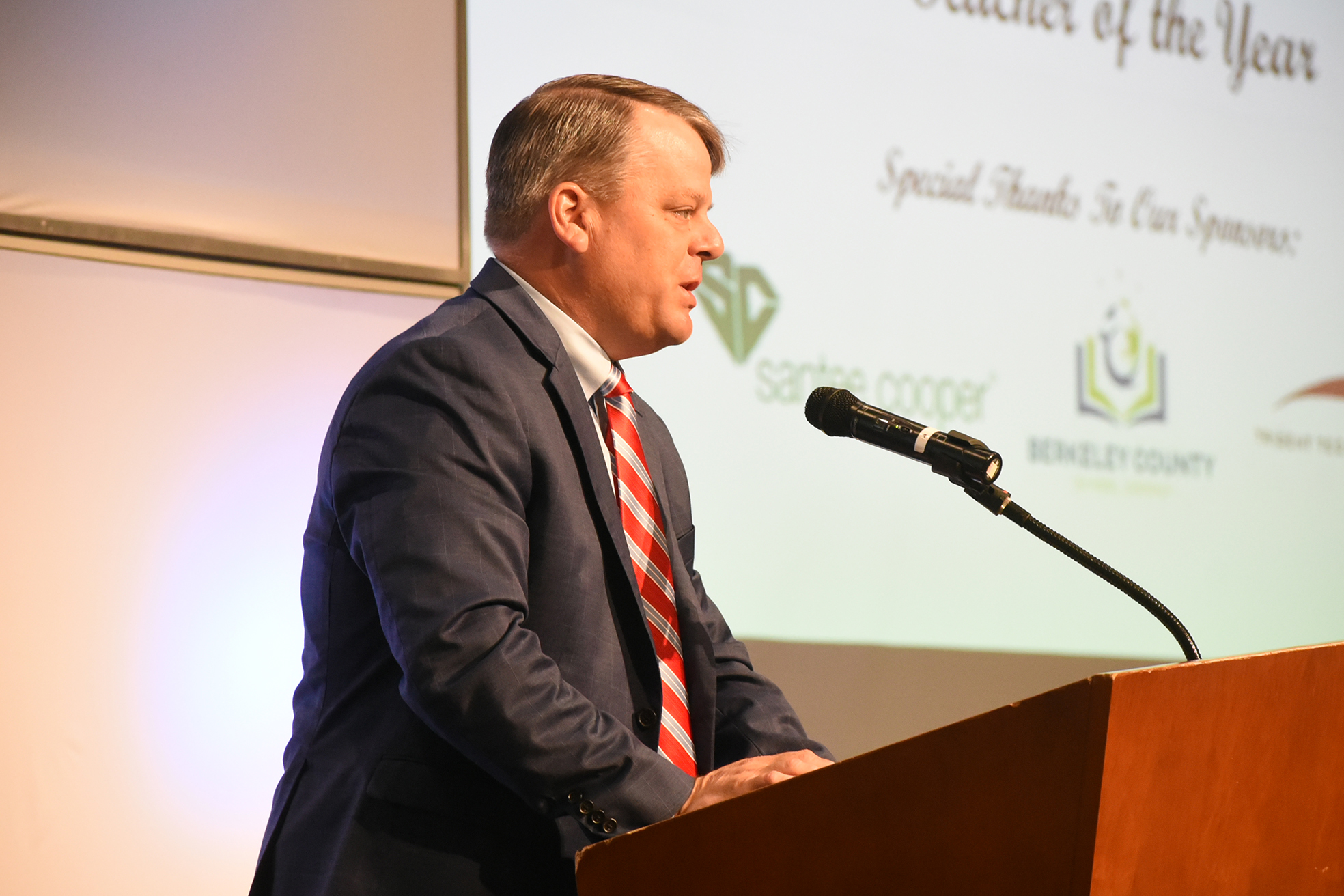 man chamber member at podium