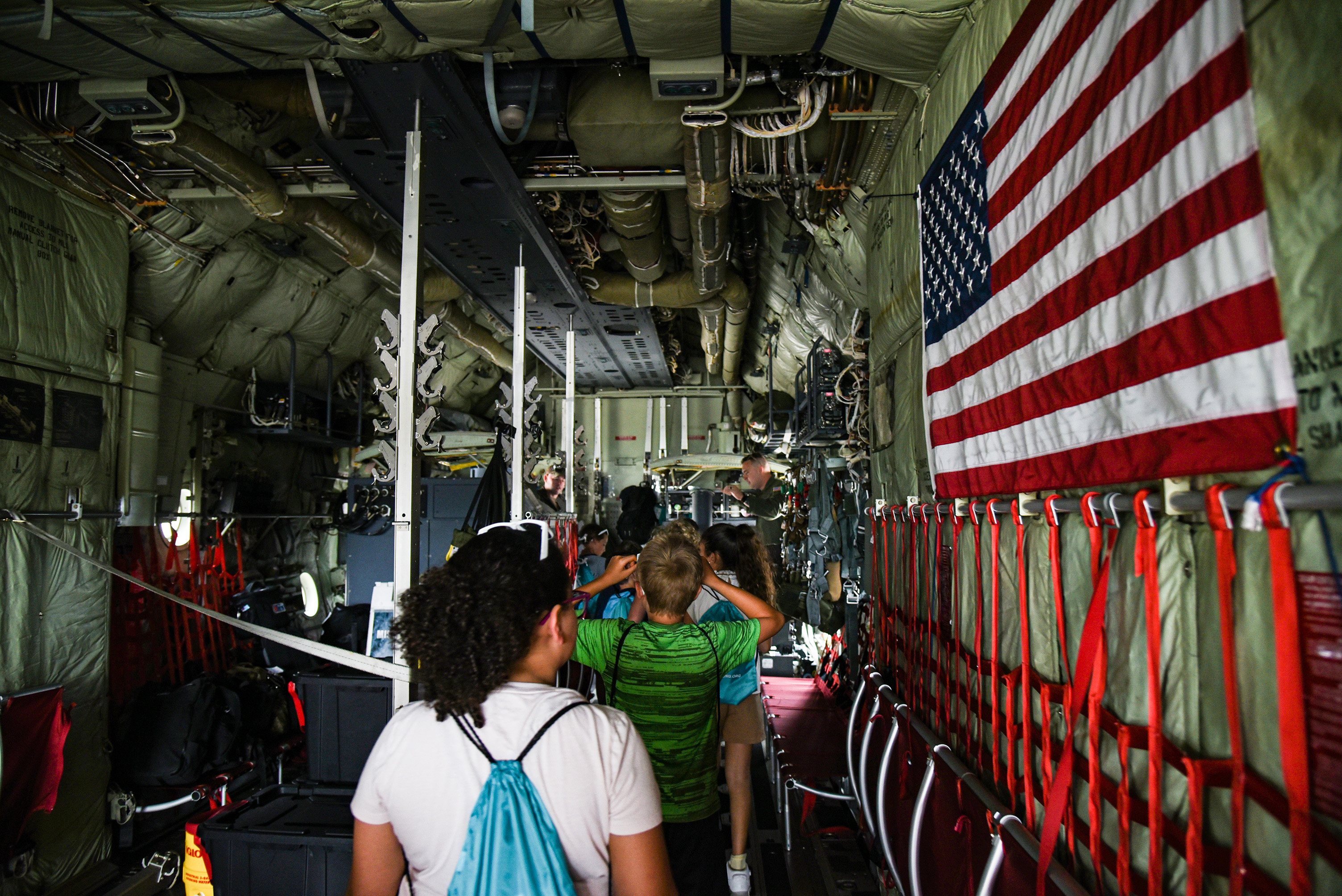 students walking through aircraft