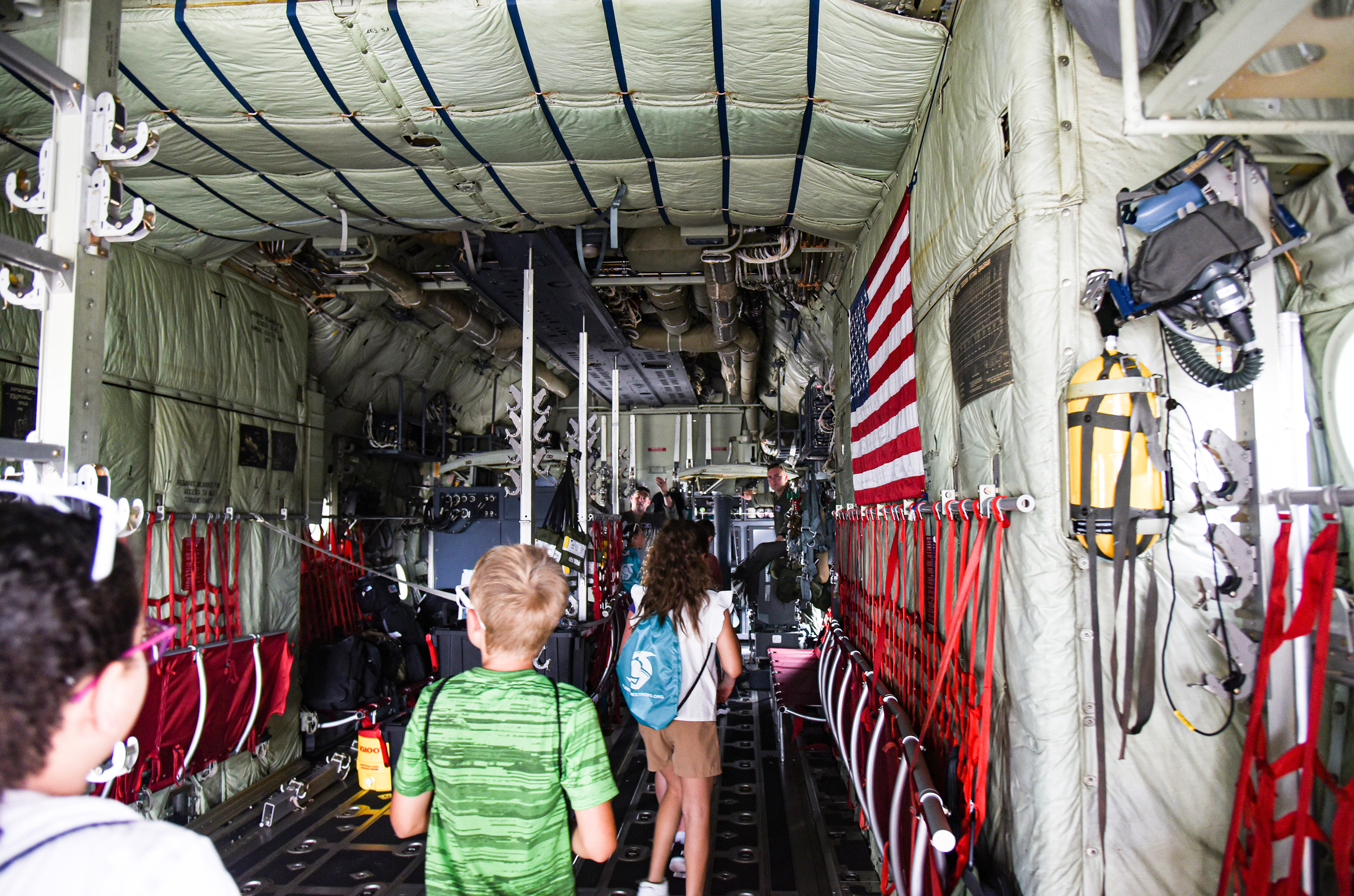 students walking through aircraft