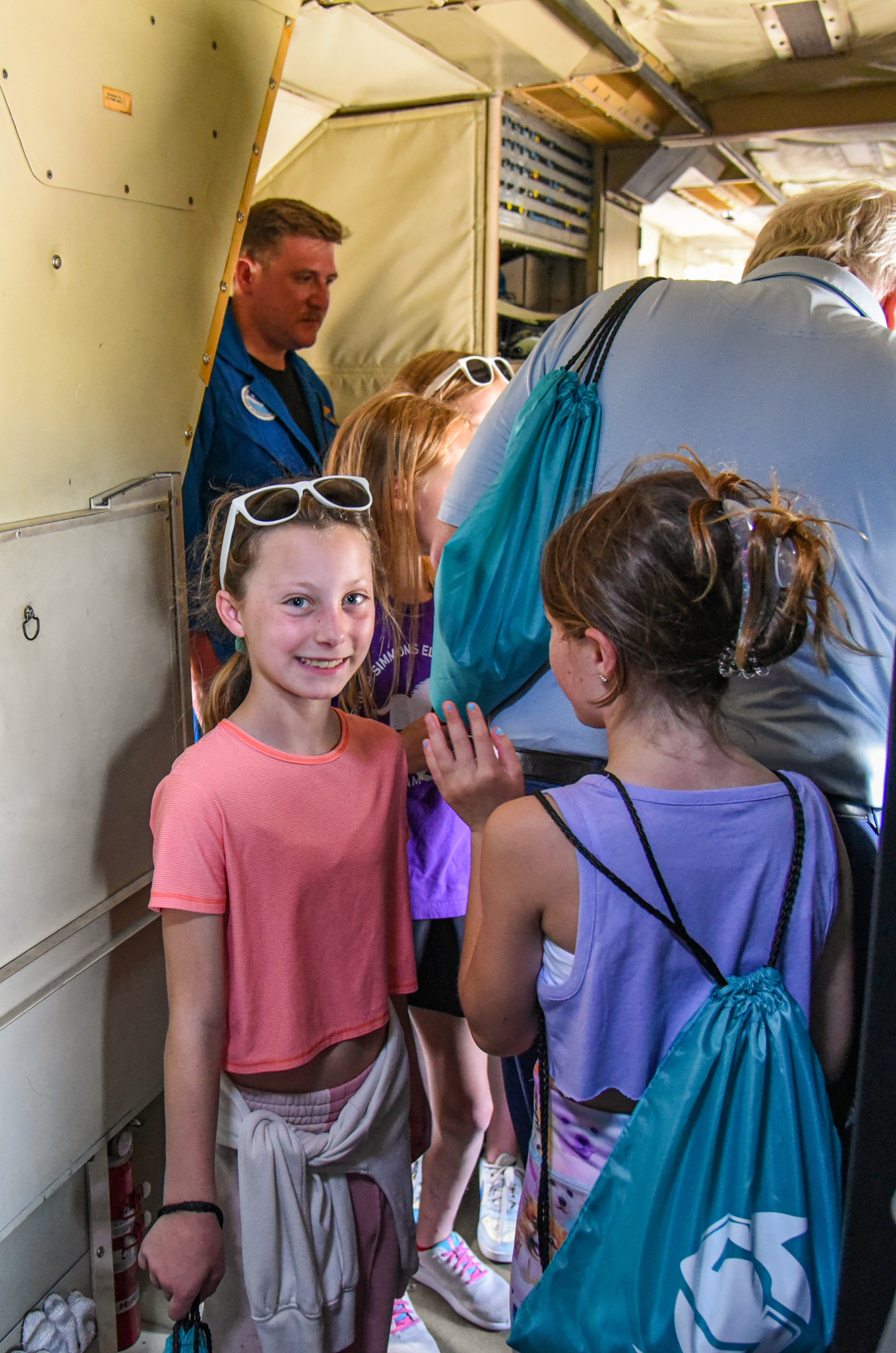 students walking through plane