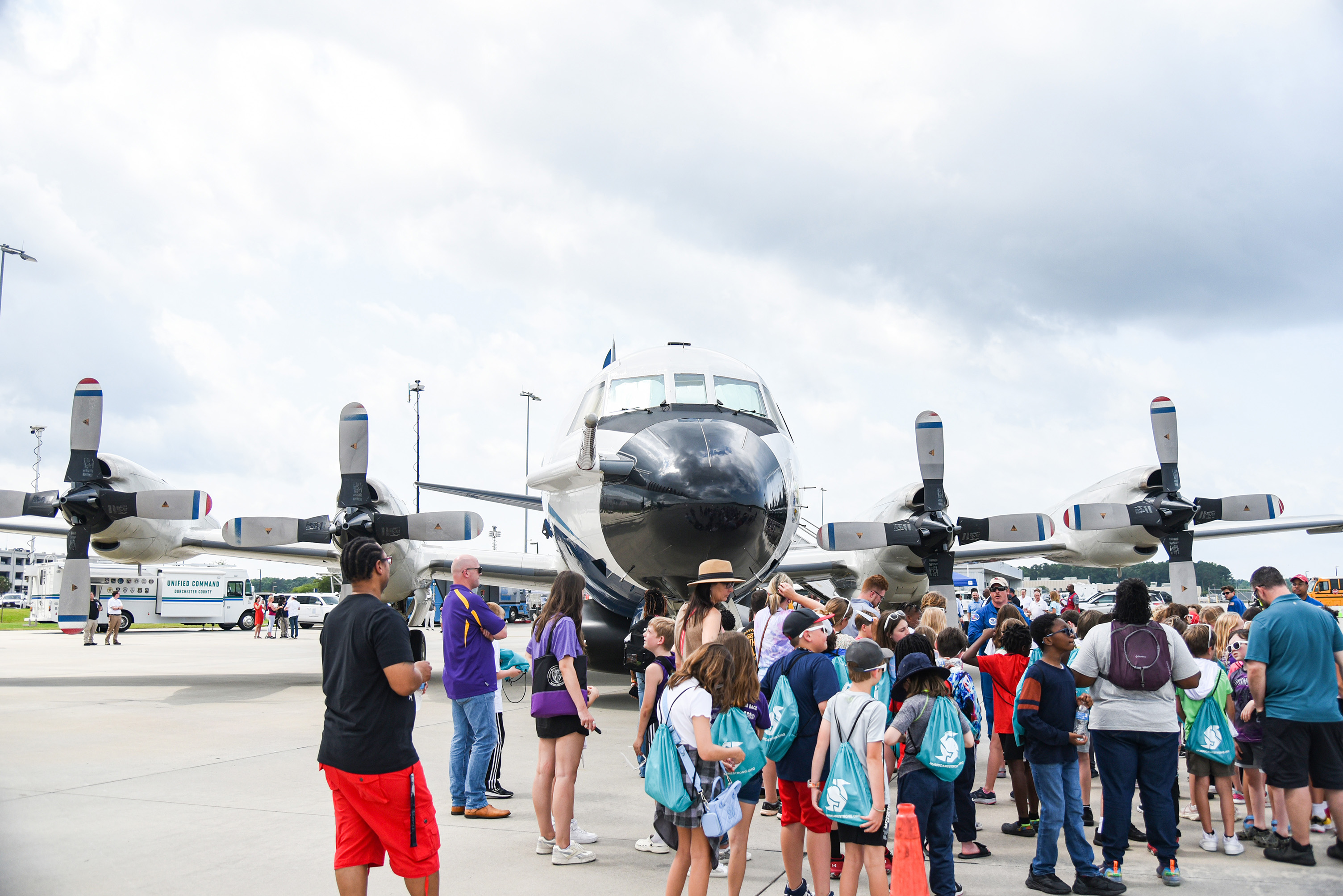 students gathering outside second plane