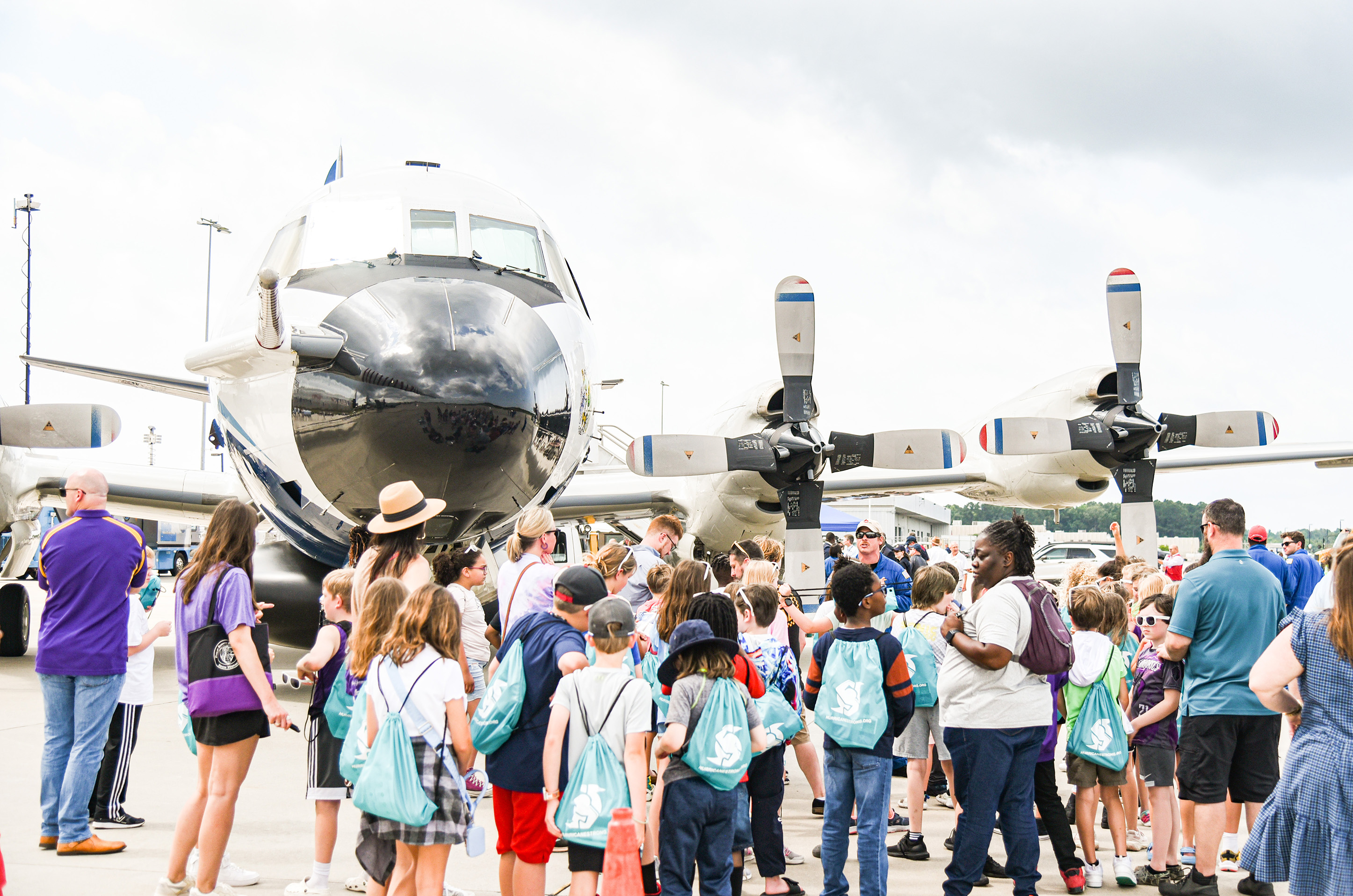 students gathering outside second plane